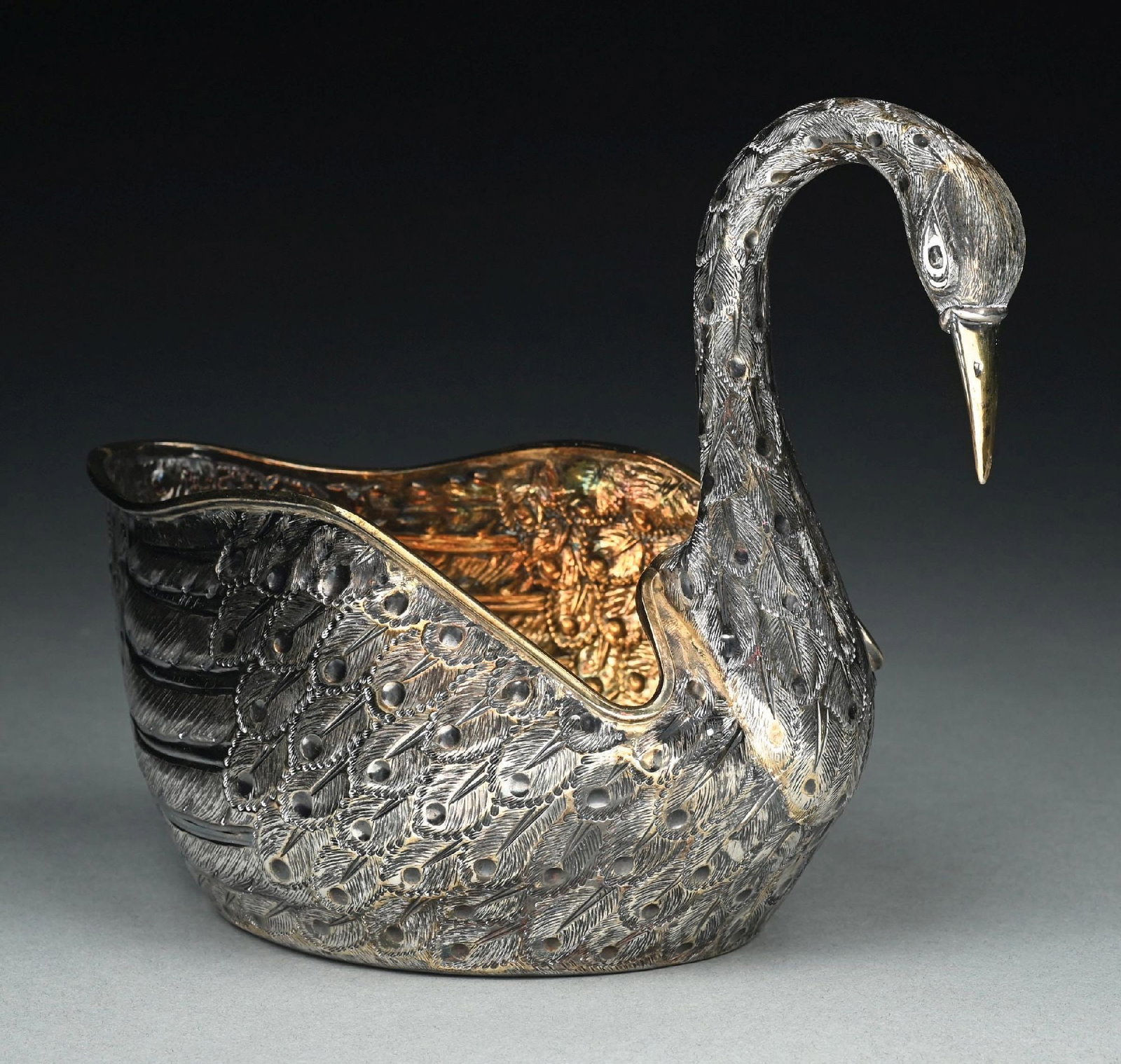 A MEXICAN STERLING BOWL IN THE FORM OF A SWAN: Tane, realistically chased with feathers, the interior gilt. Height: 7-3/4". Weight: 30.5 ozt. Condition: Dimensions: