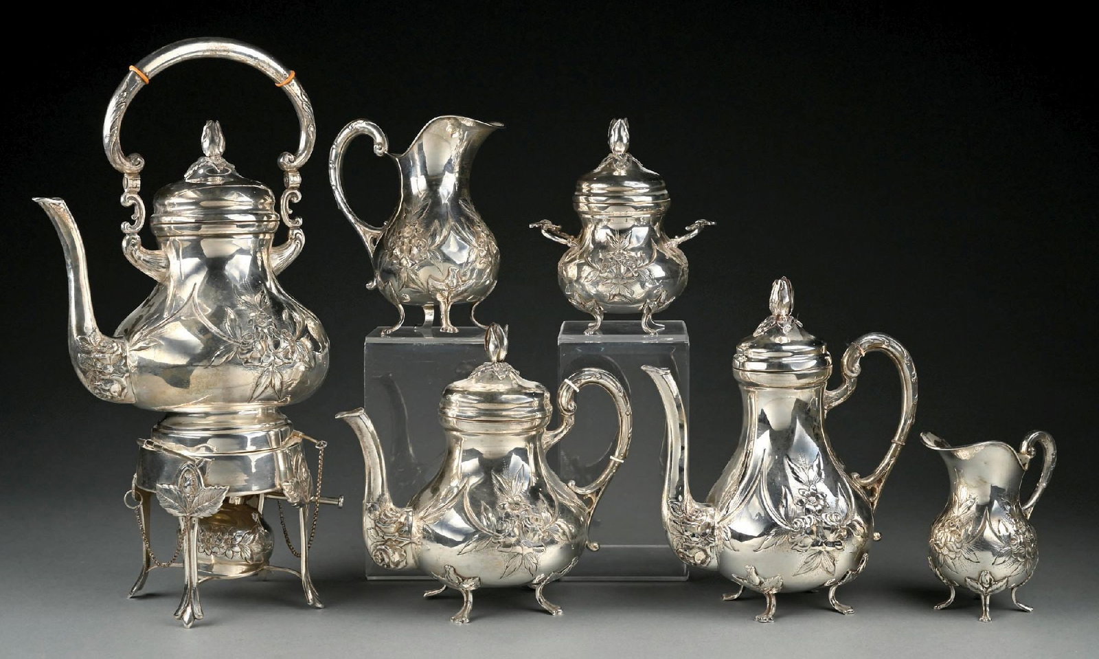 COLLECTION OF 6: MADE IN GERMANY .925 STERLING SILVER ENGRAVED FLORAL PATTERN TEA SET: Bottom of large pot dented. Gross weight: 115.0 ozt Condition: (Very Good). Dimensions: