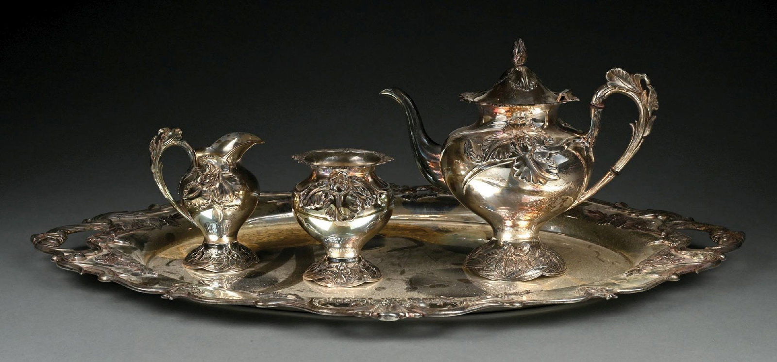 4-PIECE MIYATA .950 STERLING SILVER HAND-CHASED TEA SET: Oxidation throughout set, tray with oxidation and water staining; otherwise, good to very good condition. Gross weight: 148.9 ozt Condition: (Good - Very Good). Dimensions: