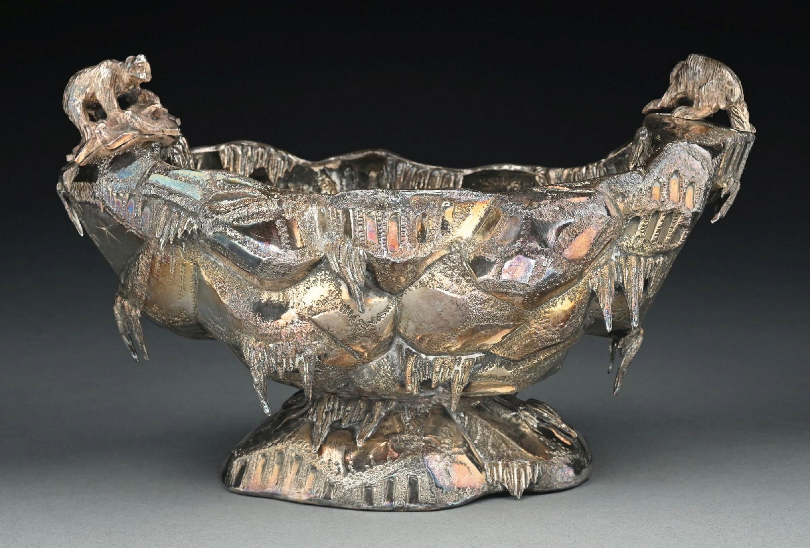 A GORHAM STERLING ICE BOWL: 19th century. Chased as an ice berg with two polar bear handles. Length: 10-3/4" across. Weight: 24.2 ozt. Condition: Dimensions: