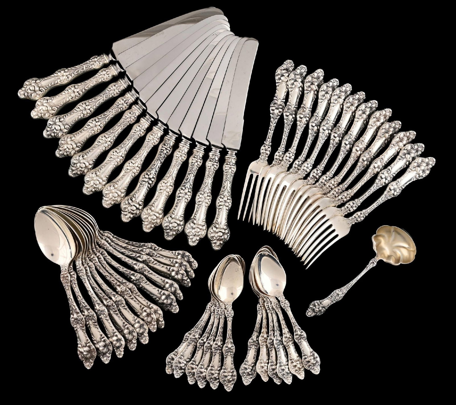 AN AMERICAN STERLING FLATWARE SET: Alvin Orange Blossom pattern, comprising 12 forks, 7-1/2"; 12 spoons with oval bowls, 7-1/8"; 12 teaspoons; a small gravy or sauce ladle; and twelve knives, 9-5/8", with stainless blades. Total