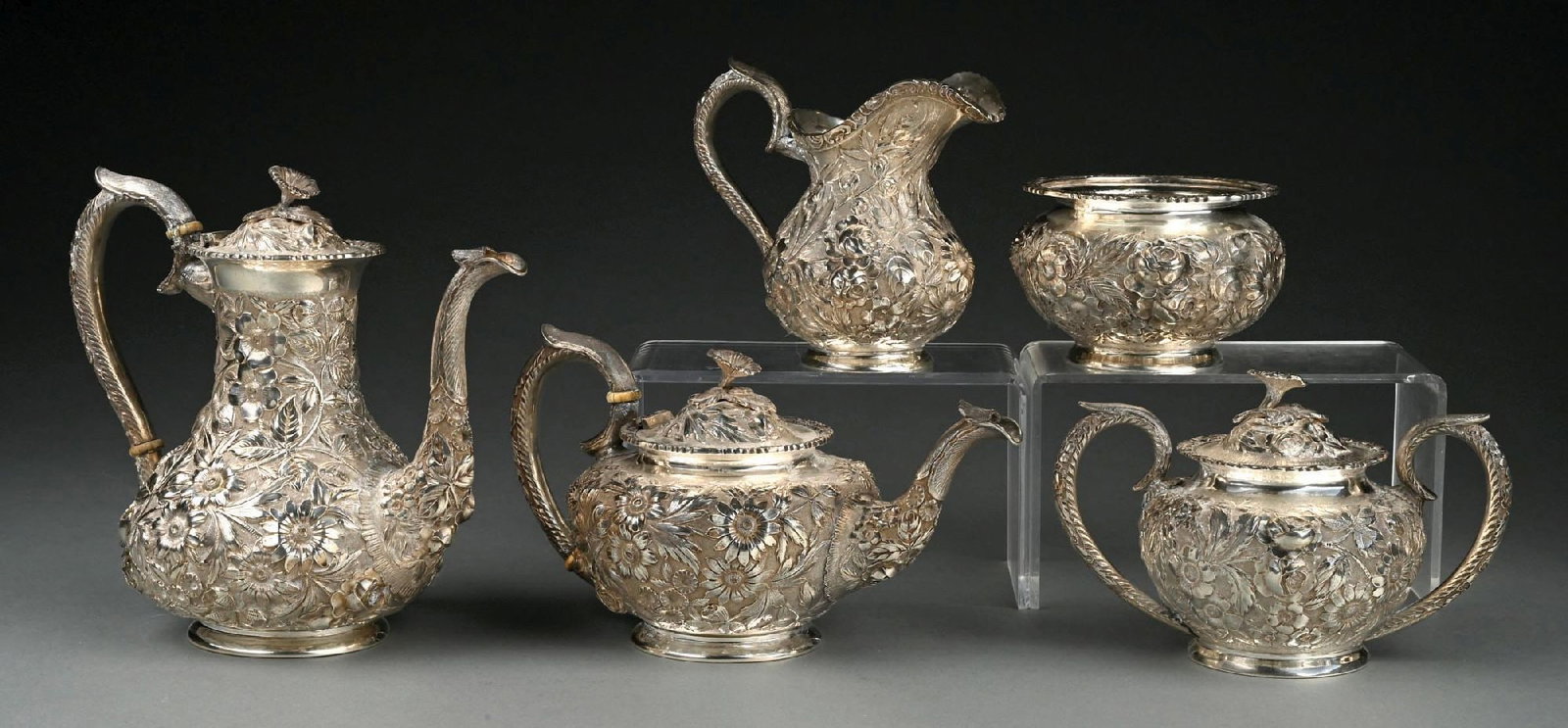 COLLECTION OF 5: RITTER & SULLIVAN "BALTIMORE ROSE" REPOUSSE AND HAND-CHASED STERLING SILVER TEA SET: Engraved presentation under bases. Gross weight: 82.1 ozt Condition: (Very Good - Excellent). Dimensions: