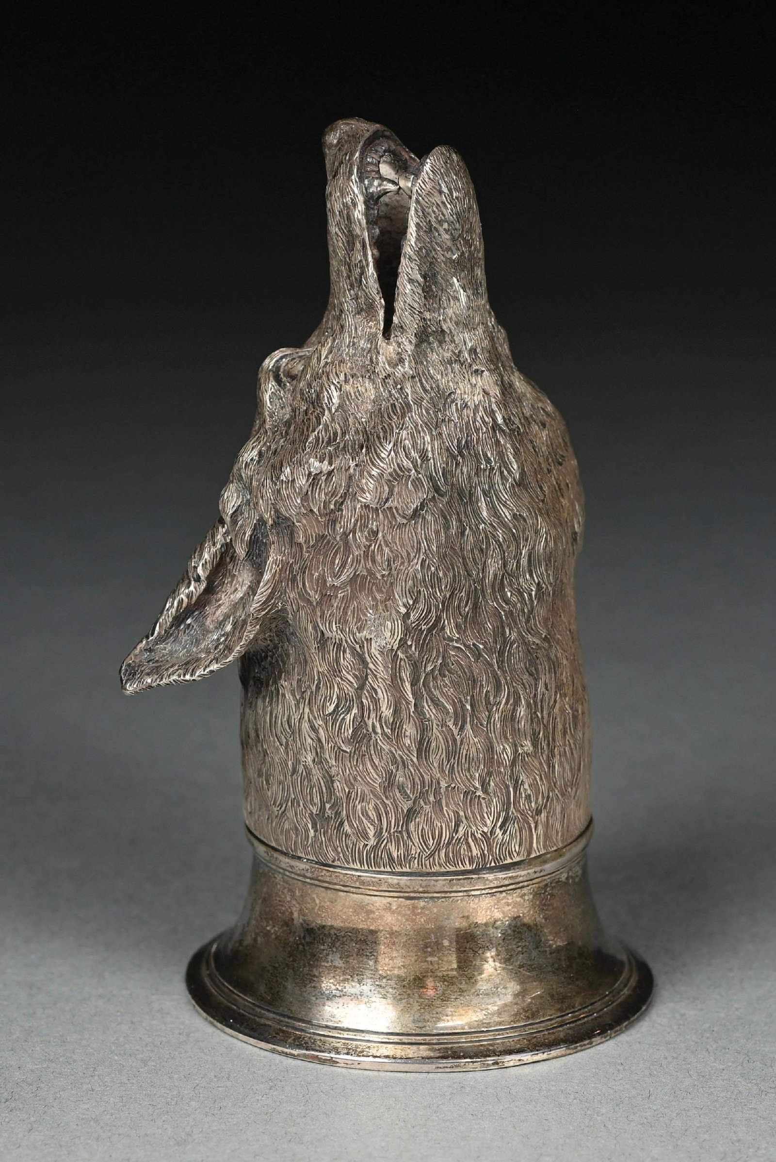 AN ENGLISH SILVER STIRRUP CUP: C T & G Fox, London 1864, the top chased as a fox’s head. Height: 4-3/4". Weight: 19.9 ozt. Condition: Dimensions: