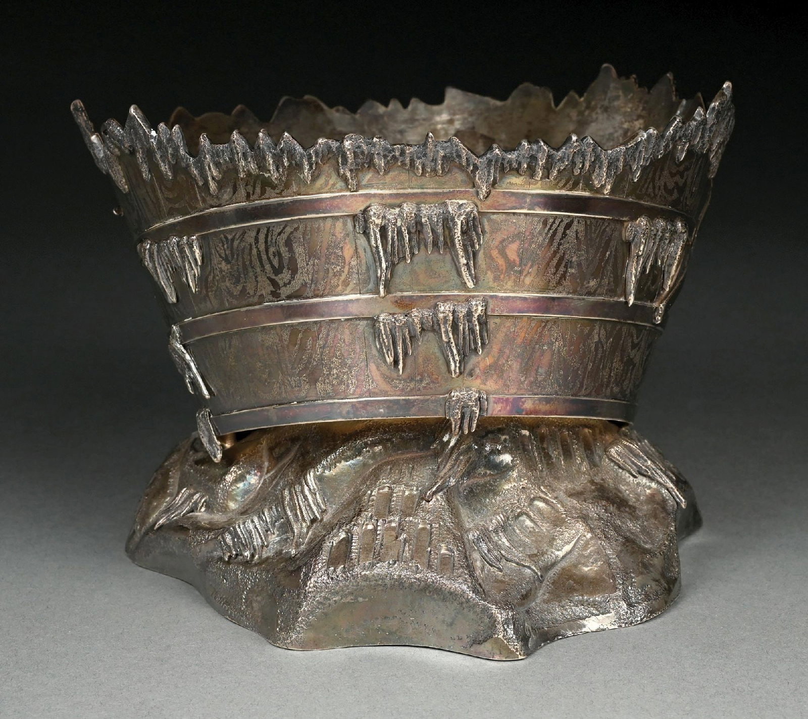 A GORHAM STERLING ICE BUCKET: 1874, formed as a partial bucket with icicles and on a rock and ice base. Height: 5-1/4". Weight: 29.5 ozt. Condition: Dimensions: