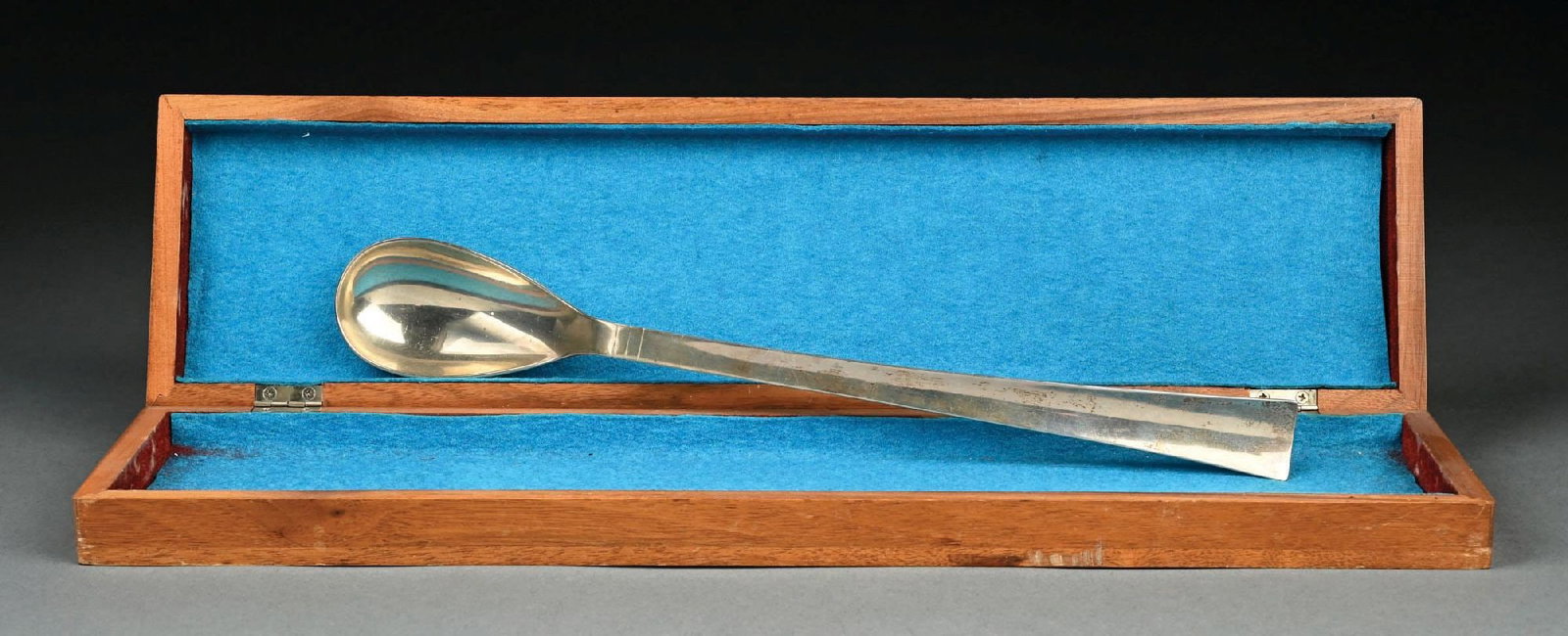 ALLAN ADLER HANDMADE STERLING SILVER SERVING SPOON IN WOODEN CASE: Allan Adler sterling silver serving spoon in wooden case. Length measures 12-1/2". Gross weight is 3.16 ozt. Signed "Allan Adler" and marked "Handmade Sterling". Condition: (Very Good). Dimensions: