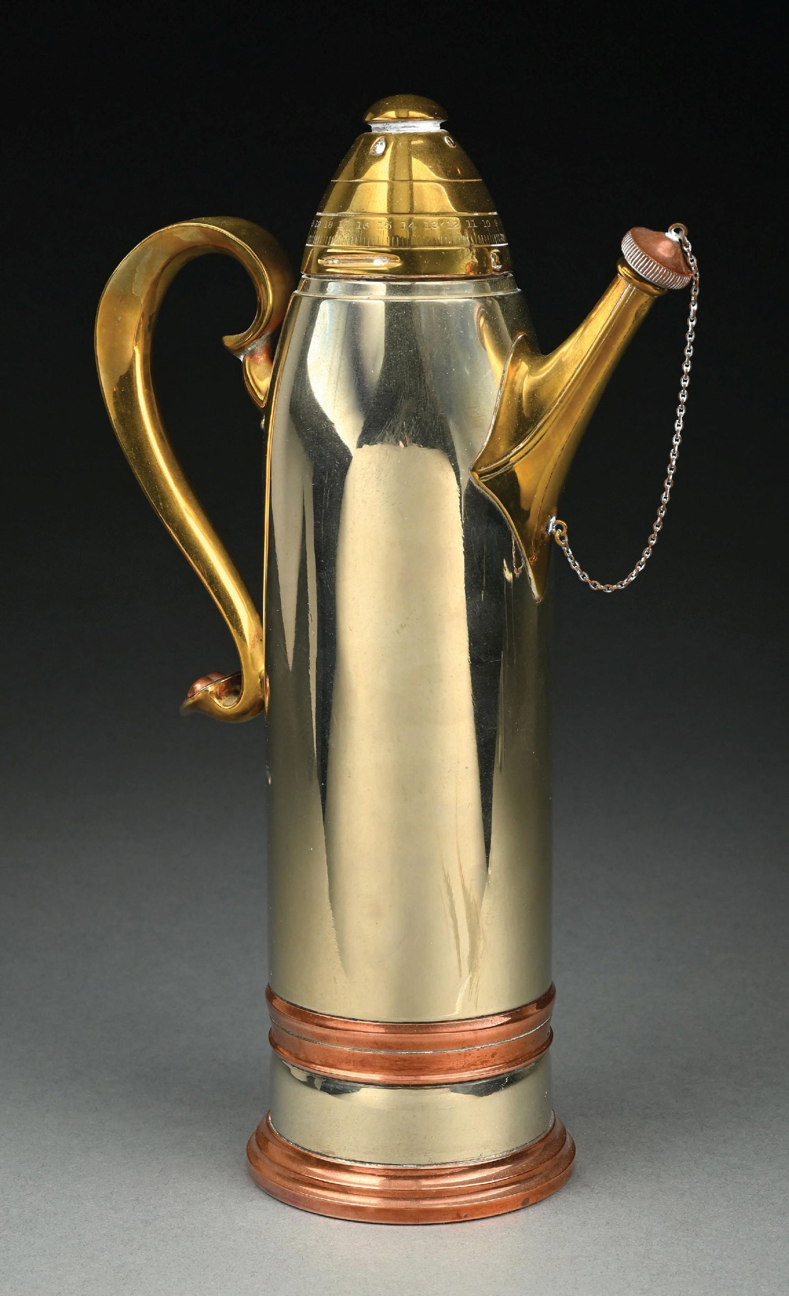 SILVER PLATED MIXED-METAL ARTILLERY SHELL COCKTAIL SHAKER: Silver plated mixed-metal artilary shell cocktail shaker. Marked "01077" under base. Unsigned, but attributed to American silversmith, Gorham Manufacturing Company. Height measures 12-1/2" tall. Condi