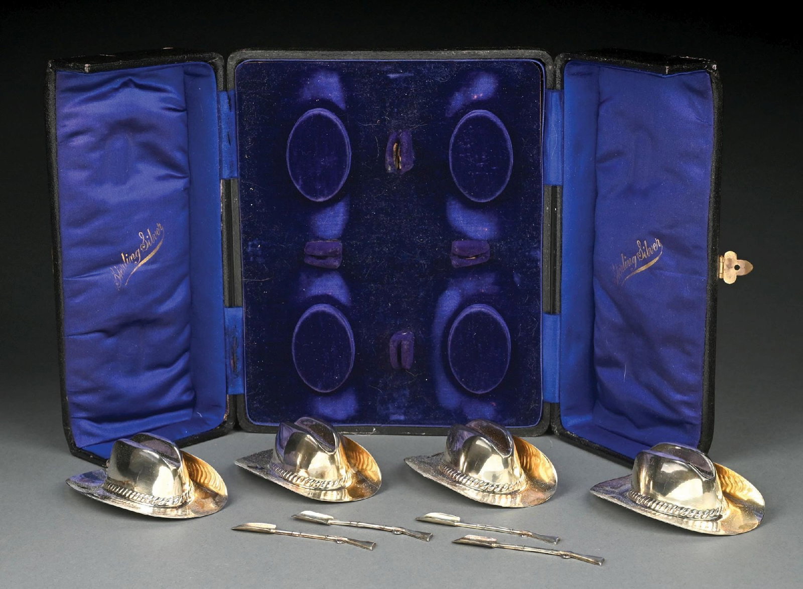 VINTAGE T.W. STERLING SILVER COWBOY HAT AND SHOWELS 8-PIECE SET IN BOX: Full English hallmarks. Original fitted case. Gold gilt finish. Gross weight: 7.3 ozt Condition: (Very Good). Dimensions: