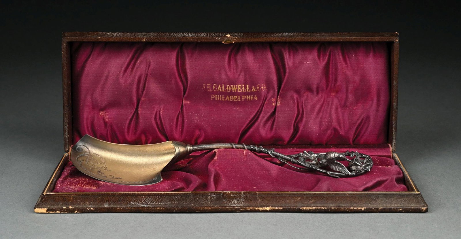 A WHITING STERLING FIGURAL OYSTER SPOON: With a shaped gilt bowl, the branch stem with a cast and chased bird at the end. Length: 9-3/4". Weight: 3.1 ozt. Condition: Dimensions: