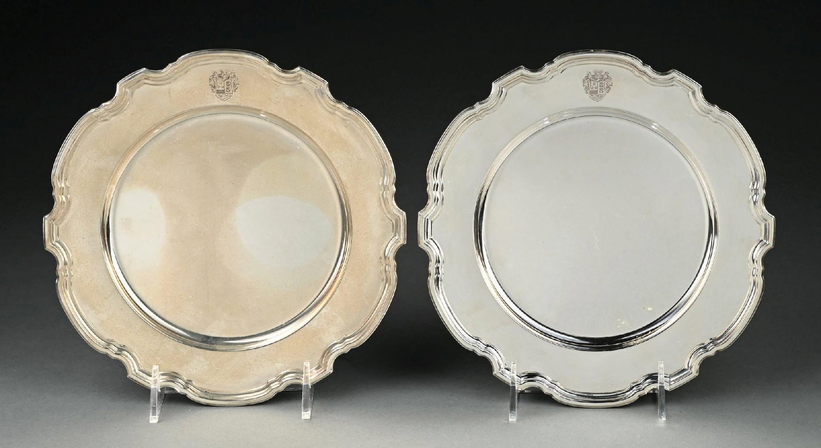 COLLECTION OF 2: TIFFANY & CO. STERLING SILVER SCALLOPED SERVING PLATTERS: Each having a monogrammed coat of arms. Gross weight: 26.2 ozt Condition: (Very Good - Excellent). Dimensions: