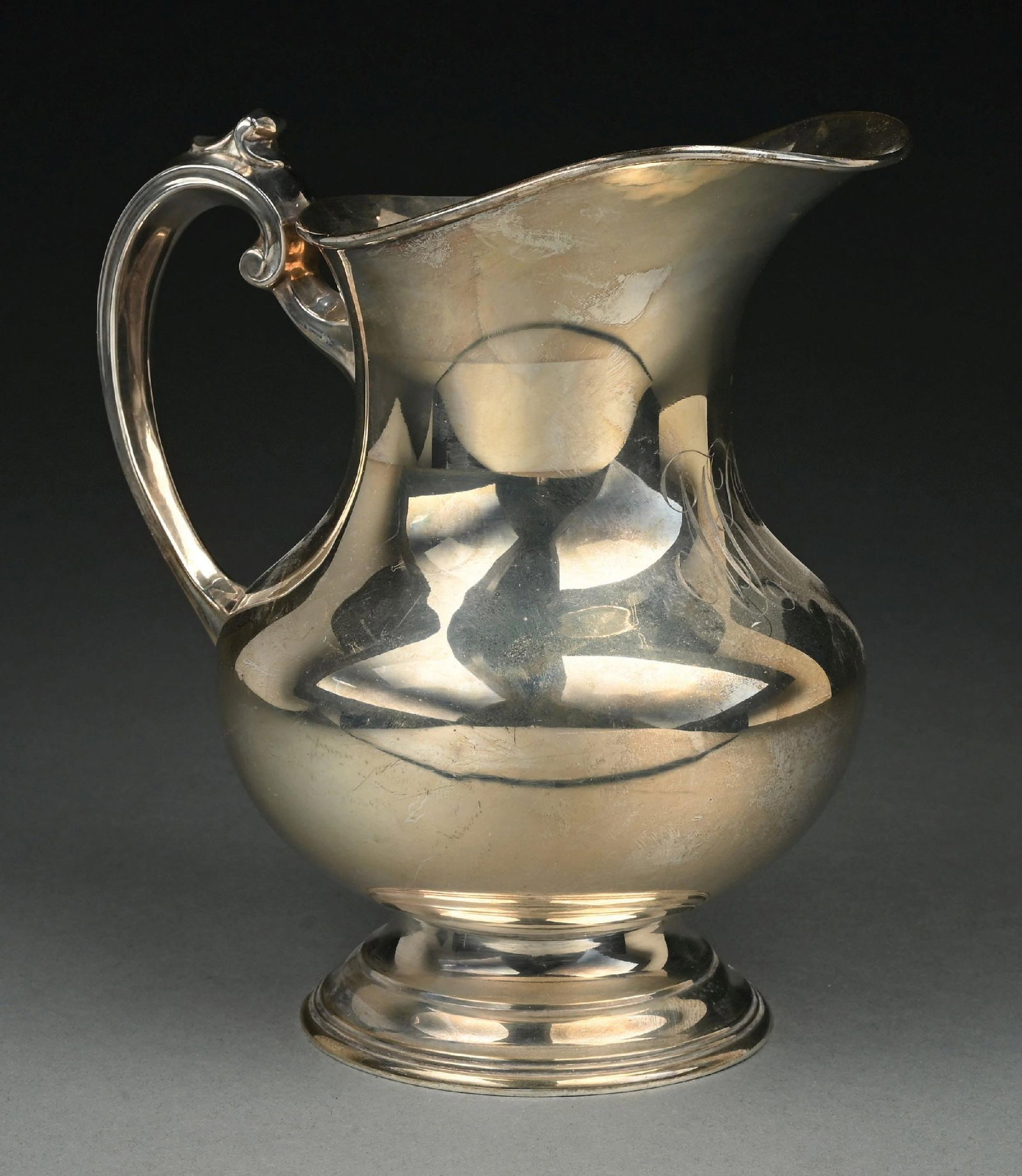 REED & BARTON STERLING SILVER X766 8-CUP WATER PITCHER: Monogrammed. Gross weight: 25.8 ozt Condition: (Very Good). Dimensions: