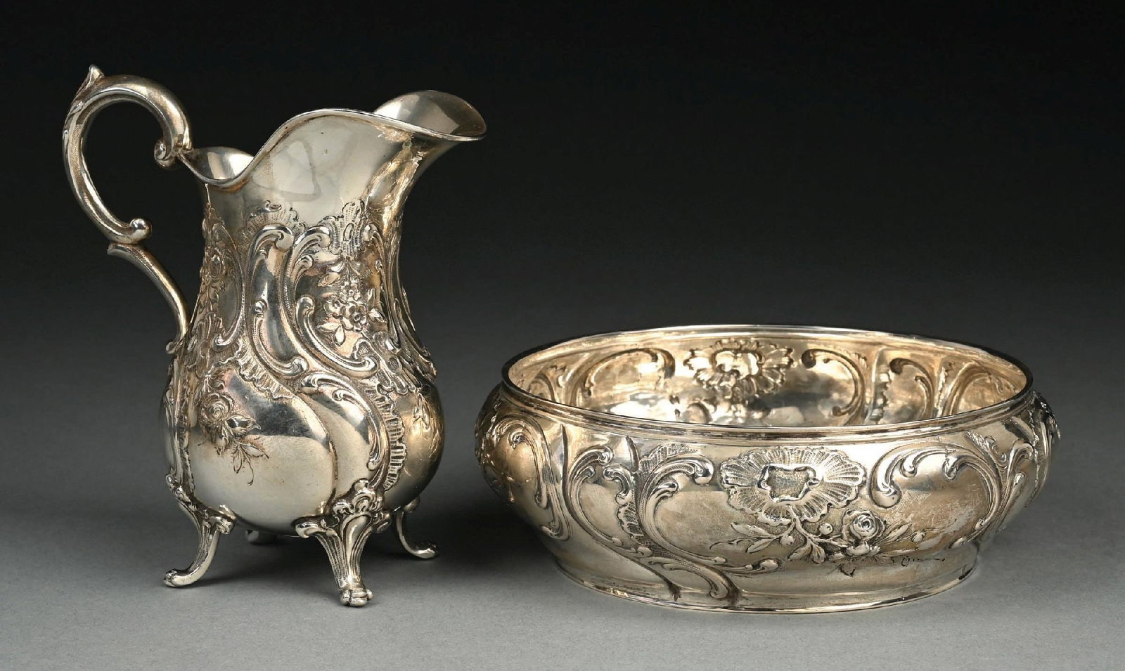 COLLECTION OF 2: SMALL REPOUSSE STERLING SILVER FLORAL PATTERN PITCHER AND BOWL: Gross weight: 22.3 ozt Condition: (Very Good - Excellent). Dimensions: