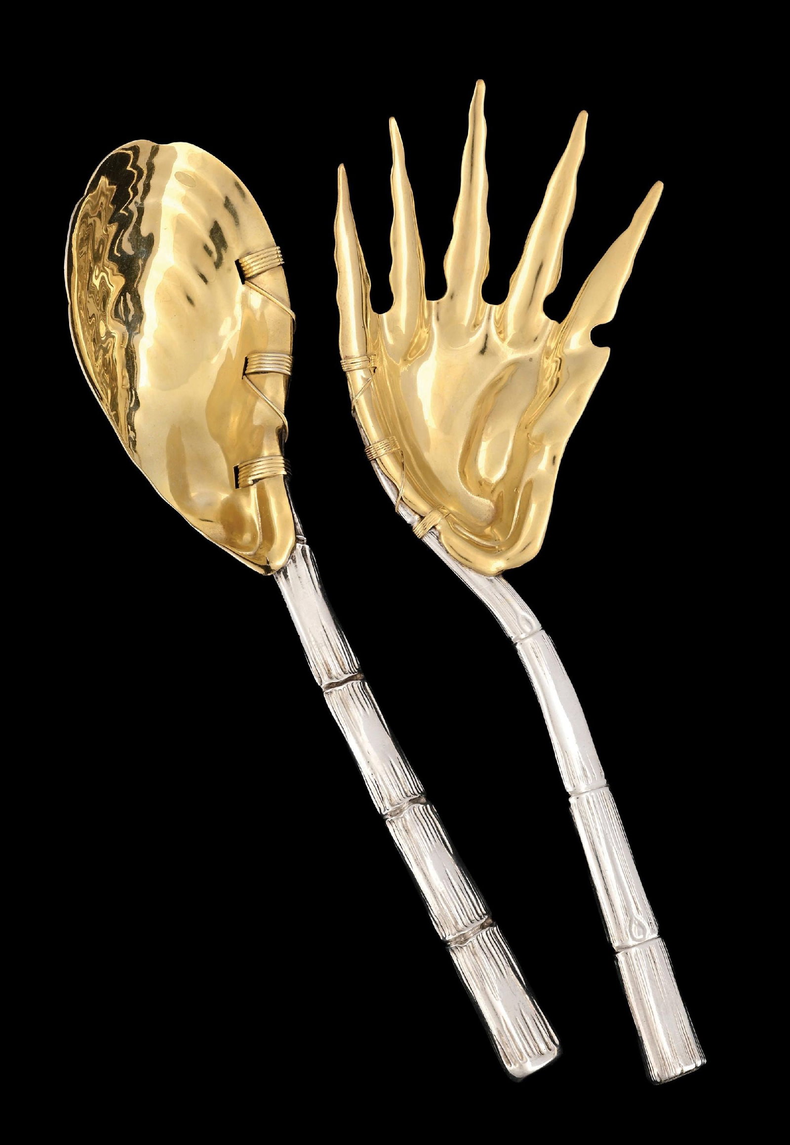 A PAIR OF GORHAM STERLING BAMBOO SALAD SERVERS: 1891, each with a chased stem, the gilt bowl and tines formed as shells. Length: 10". Weight: 7.2 ozt. Condition: Dimensions:
