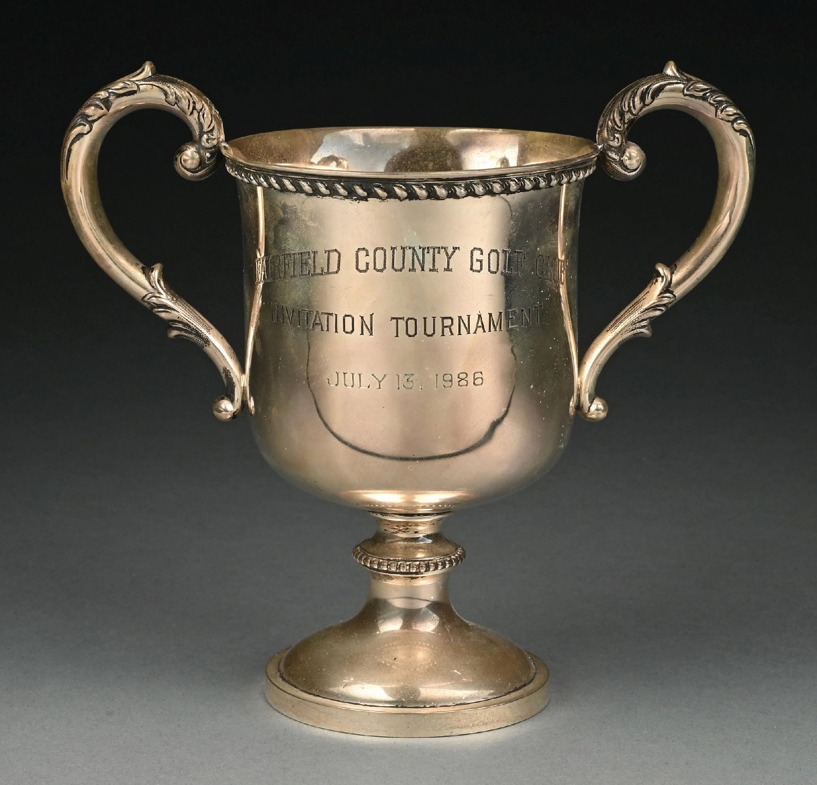 C. 1926 MARCUS & CO., STERLING SILVER GOLF TROPHY: Slightly out of round; otherwise, very good condition. Gross weight: 15.6 ozt Condition: (Good - Very Good). Dimensions:
