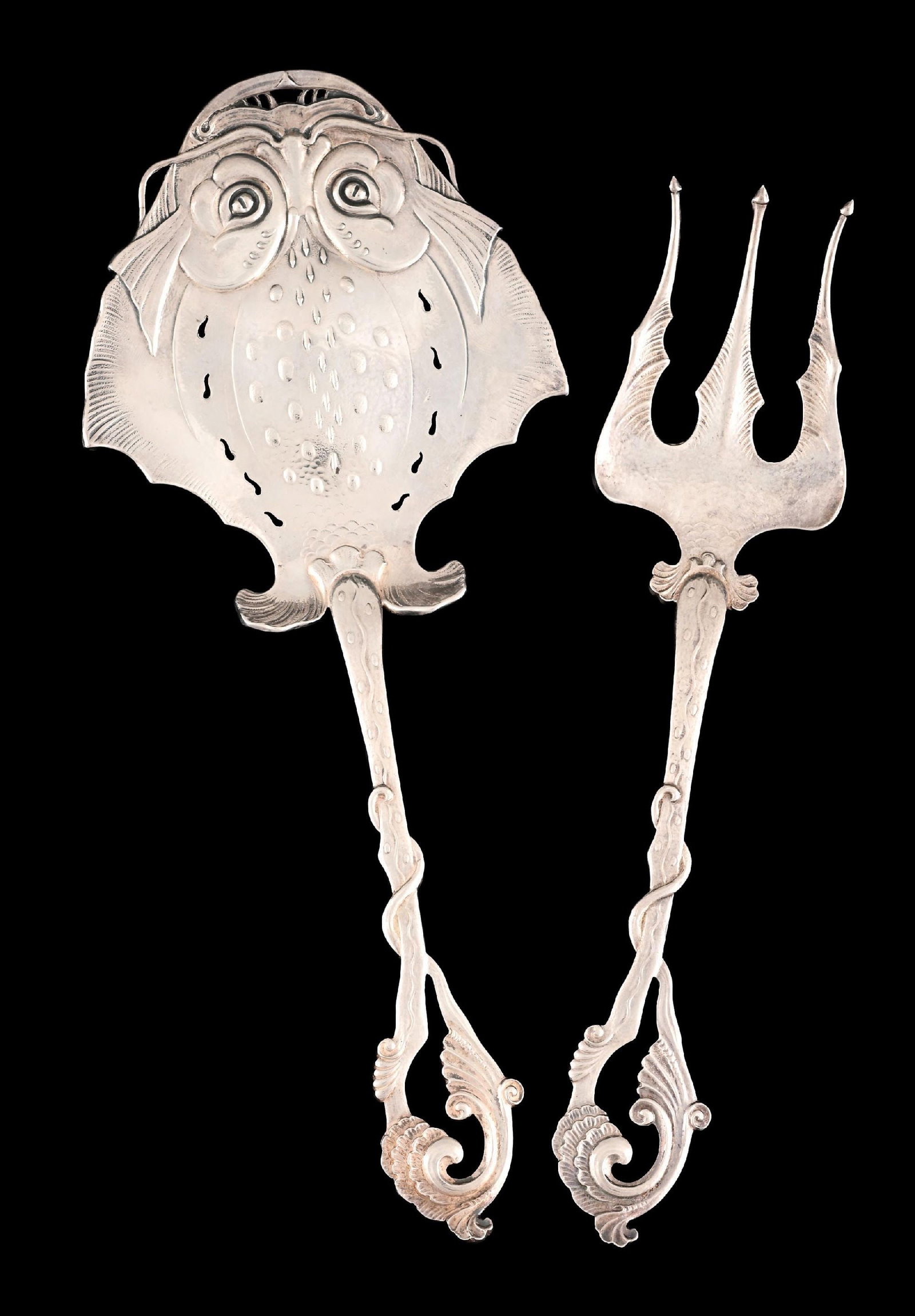 A PAIR OF NORWEGIAN SILVER FISH SERVERS: Mark of Kristian Hestenes, Bergen, the knife chased with a stylized flatfish. Length: 10-7/8". Weight: 7.7 ozt. Condition: Dimensions: