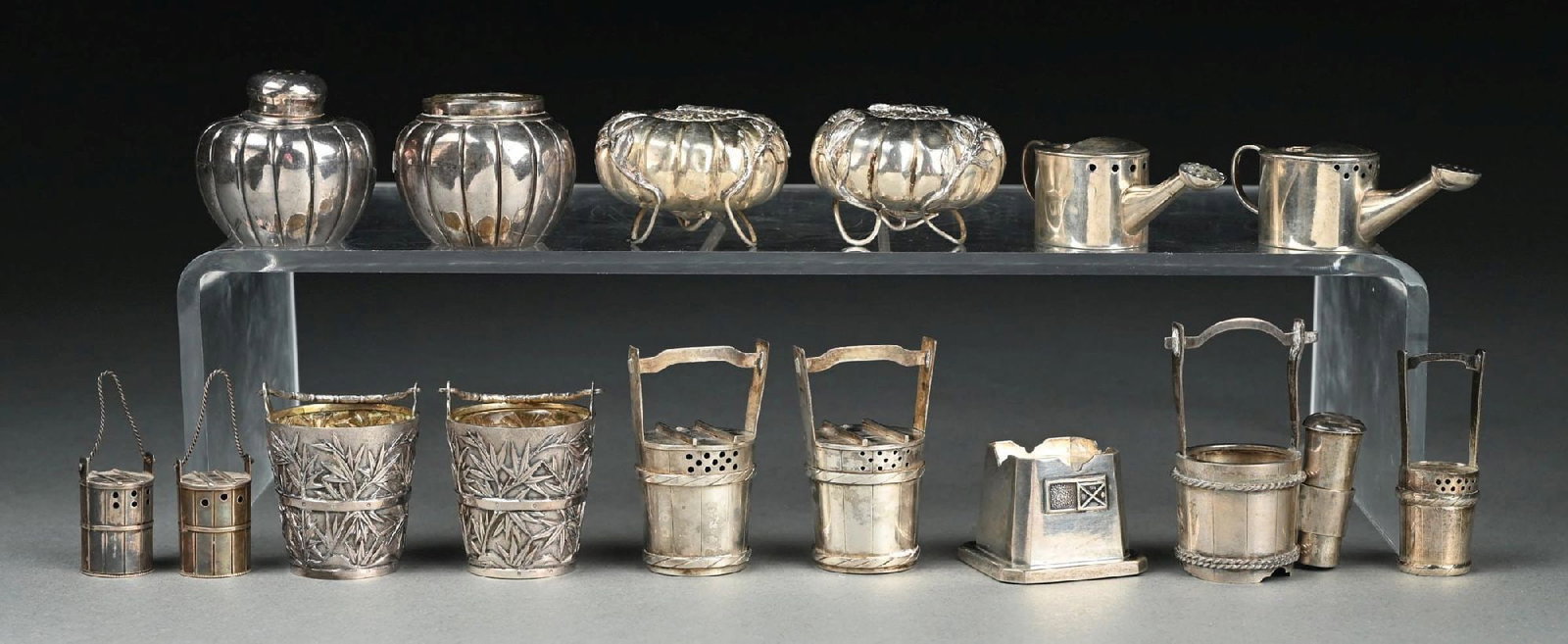 A GROUP OF JAPANESE STERLING SALT AND PEPPER CASTERS: Including melons with chrysanthemums, a pair of watering cans, a pair of water carriers, and a pair of Chinese pails WH. Height of tallest: 2-1/8". Approx. total weight: 10 ozt. Condition: Dimensions: