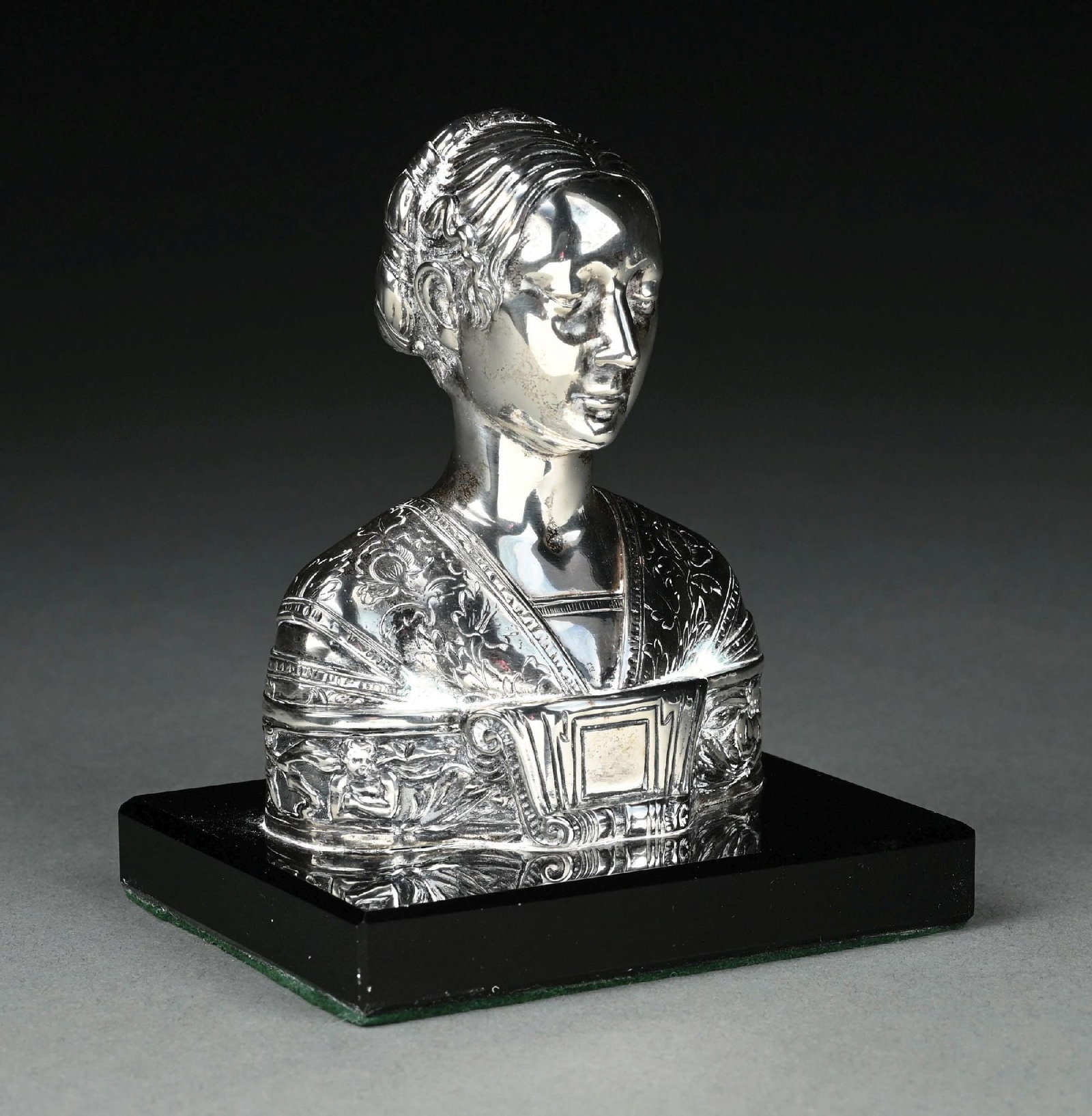 A SILVER COVERED BUST: Neresheimer, Hanau, in the Italian Renaissance style, the head and shoulders of an Italian noblewoman, on a black glass base. Height: 5". Condition: Dimensions: