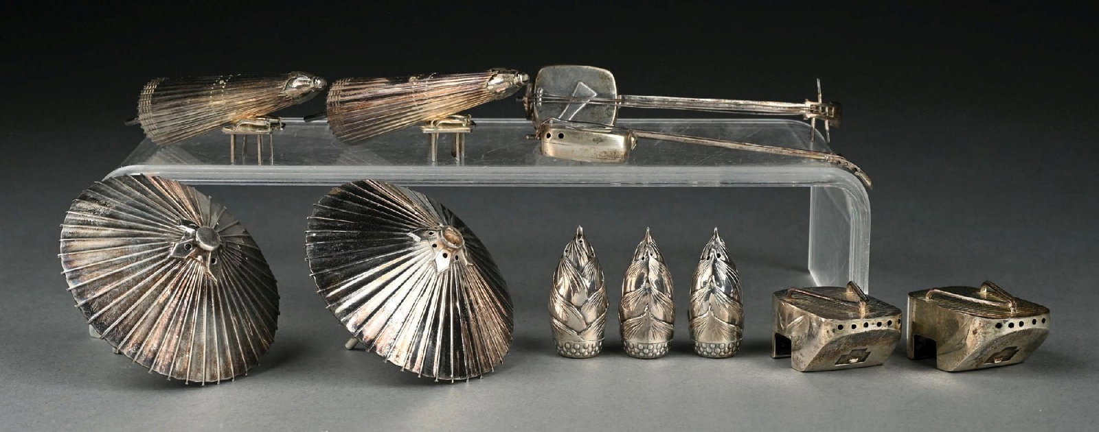COLLECTION OF 11: VARIOUS ASIAN STERLING SILVER SALT AND PEPPER SHAKERS: Marked ".950 silver". Gross weight: 5.9 ozt Condition: (Very Good). Dimensions: