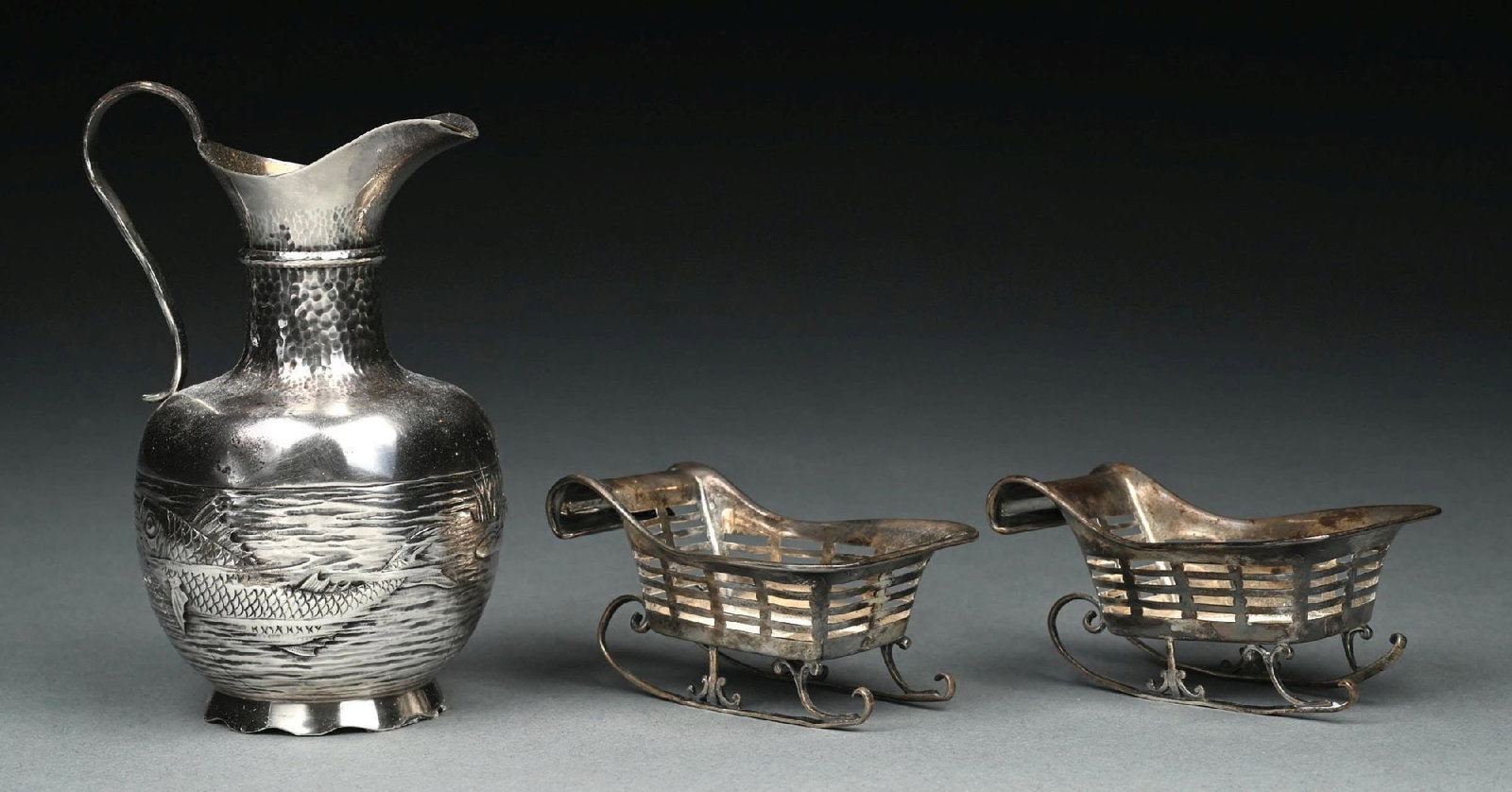 COLLECTION OF 3: STERLING SILVER ASIAN PITCHER AND SLEDS: Minor bend to sleigh rails. Gross weight: 6.5 ozt Condition: (Very Good). Dimensions: