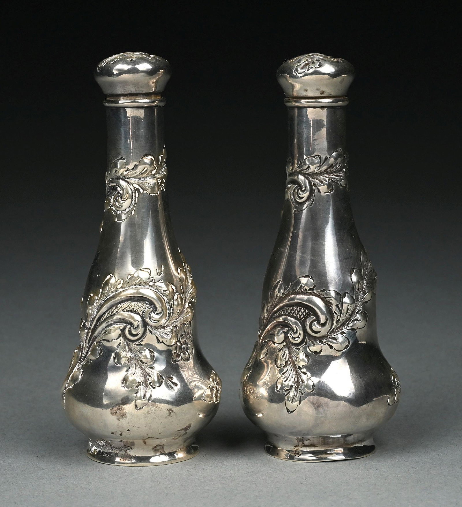 STERLING SILVER ORNATE REPOUSSE SALT AND PEPPER SHAKER SET, MARKED STERLING 402: Gross weight: 5.2 ozt Condition: (Very Good - Excellent). Dimensions:
