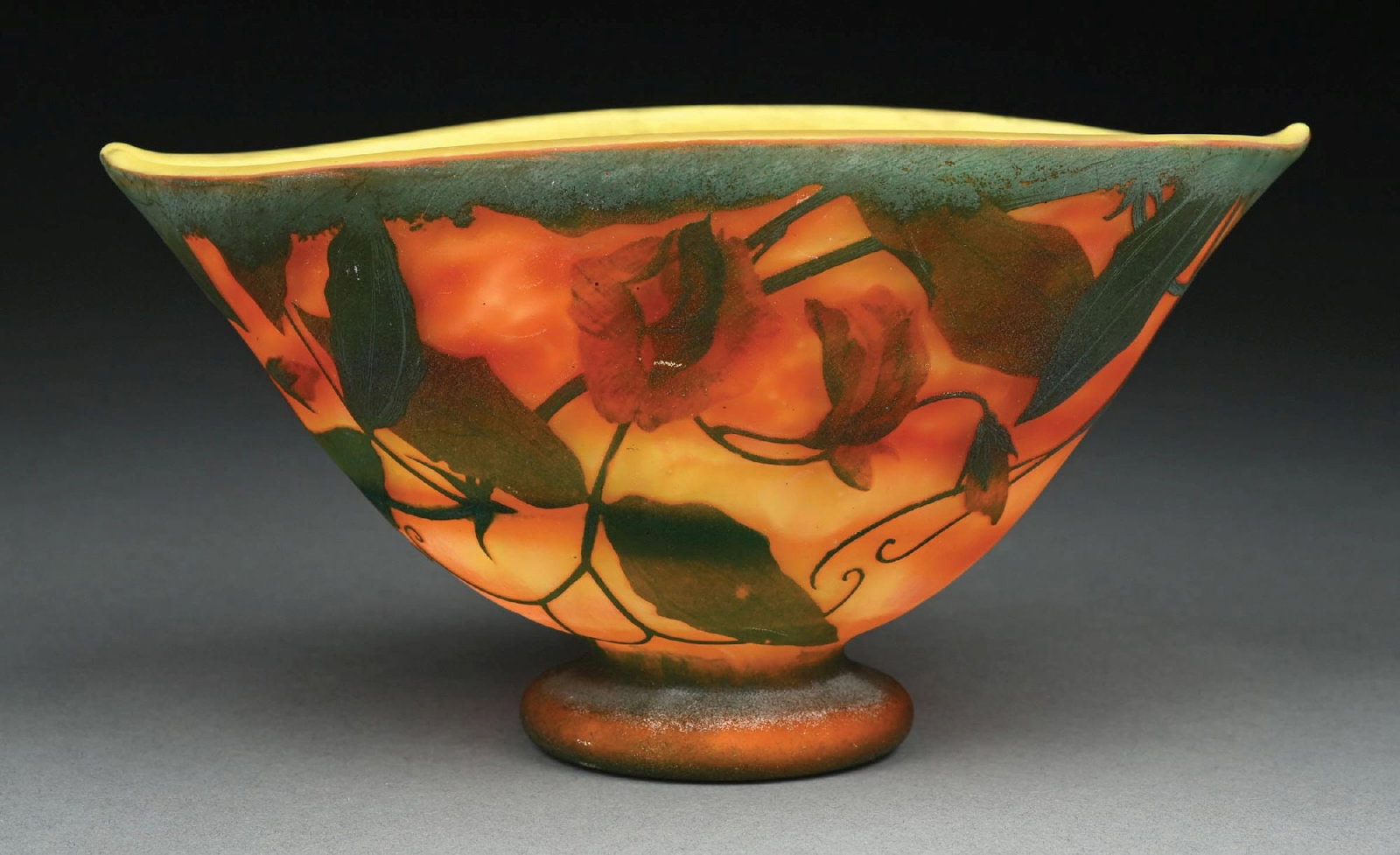 DAUM NANCY ACID-ETCHED & CAMEO GLASS VASE: A beautiful acid-etched and cameo-cut glass vase by Daum Nancy. The footed vase has a bowl-form with a 9-1/2" diameter. It is composed of a background of beautifully mottled orange, yellow, and red gl