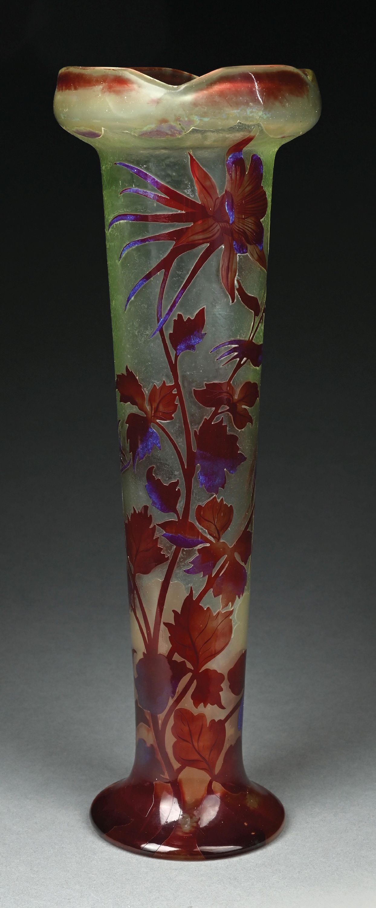GALLE CAMEO-CUT GLASS FLORAL VASE: A beautiful cameo floral vase by Galle. The 19-1/2" tall vase has a frosted background with beautiful cameo-cut flowers in red with blue iridescence. It is signed "Galle" to the side. Condition: (Very