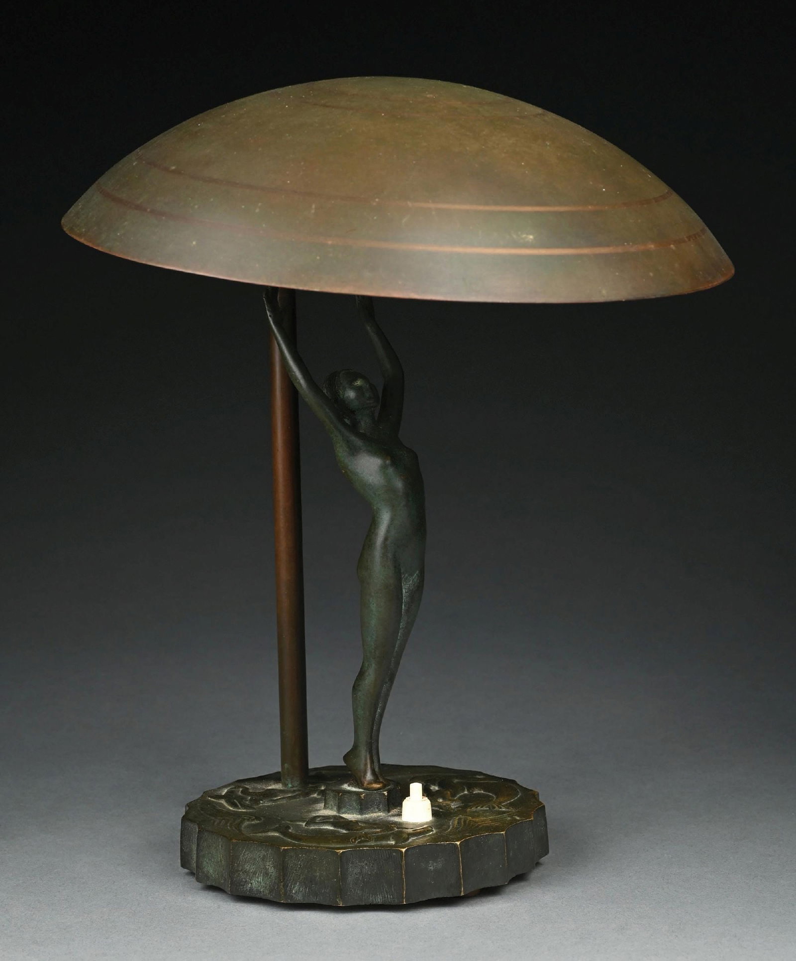 ART DECO BRONZE FIGURAL LAMP: A beautiful bronze Art Deco lamp. The figural lamp features a mermaid motif with bronze pedestal, with mermaids riding dolphins and large nude woman extending upwards from the pedestal. Large saucer-s