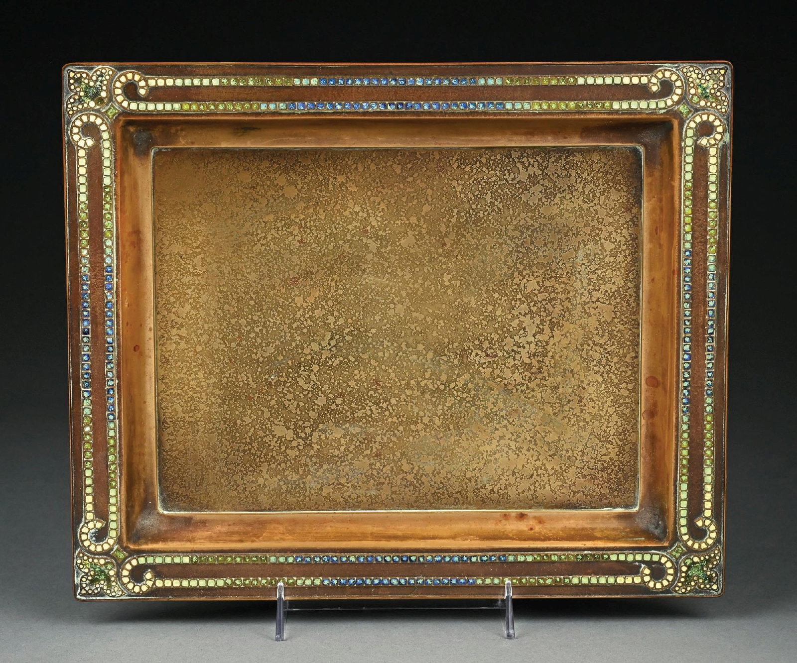 TIFFANY STUDIOS BRONZE TRAY W/ ENAMEL: A wonderful large bronze tray by Tiffany Studios with enamel decoration. The 13-3/4" long tray is composed of bronze in acid-etched gold dore. The periphery is further decorated with green, blue, and 