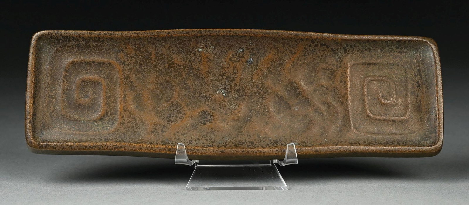 TIFFANY STUDIOS PATINATED BRONZE PEN TRAY: A lovely patinated bronze pen tray by Tiffany Studios. The acid-etched tray is finished in a lovely bronze patina, and it is signed to the back "Tiffany Studios New York 1112". Condition: (Excellent).