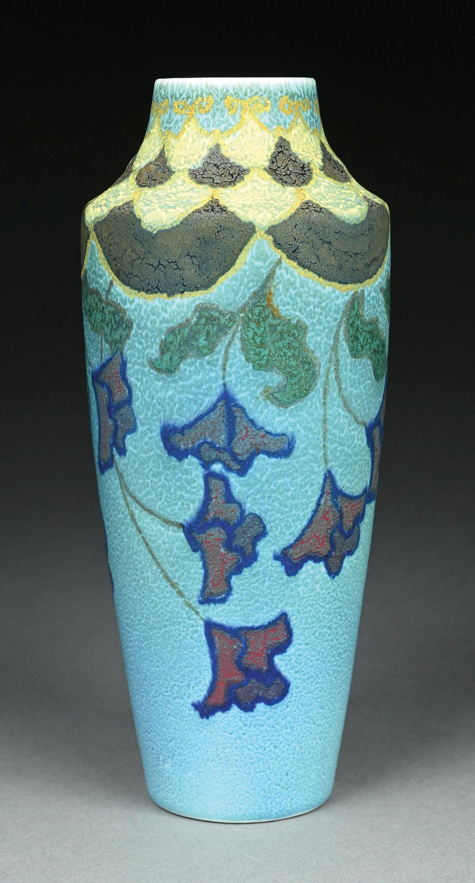 CHARLES S. TODD FOR ROOKWOOD POTTERY, C. 1922: Decorated mat vase with multi colored and raised flowers and leaves. Marked on underside with Rookwood mark, 946, XXII( 1922), C.S.T. Condition: (Near Mint). Dimensions: 4 - 1/2" Dia. x 10 - 1/2" T.