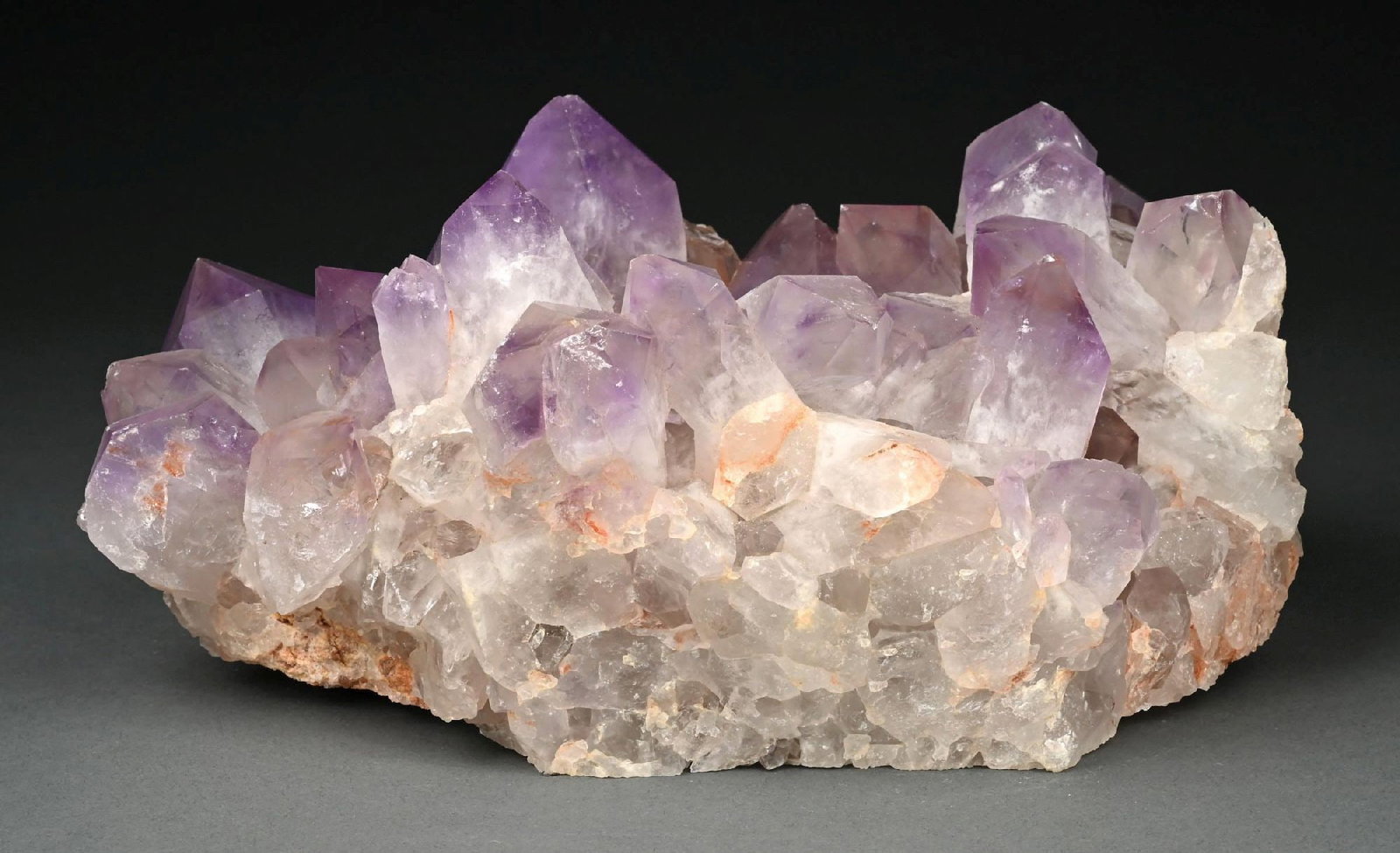 LARGE BOLIVIAN AMETHYST CRYSTAL CLUSTER: An extremely large light amethyst crystal cluster on matrix featuring well-formed terminated crystal points with good luster and shine. Areas of minor iron oxide staining are present, typical and