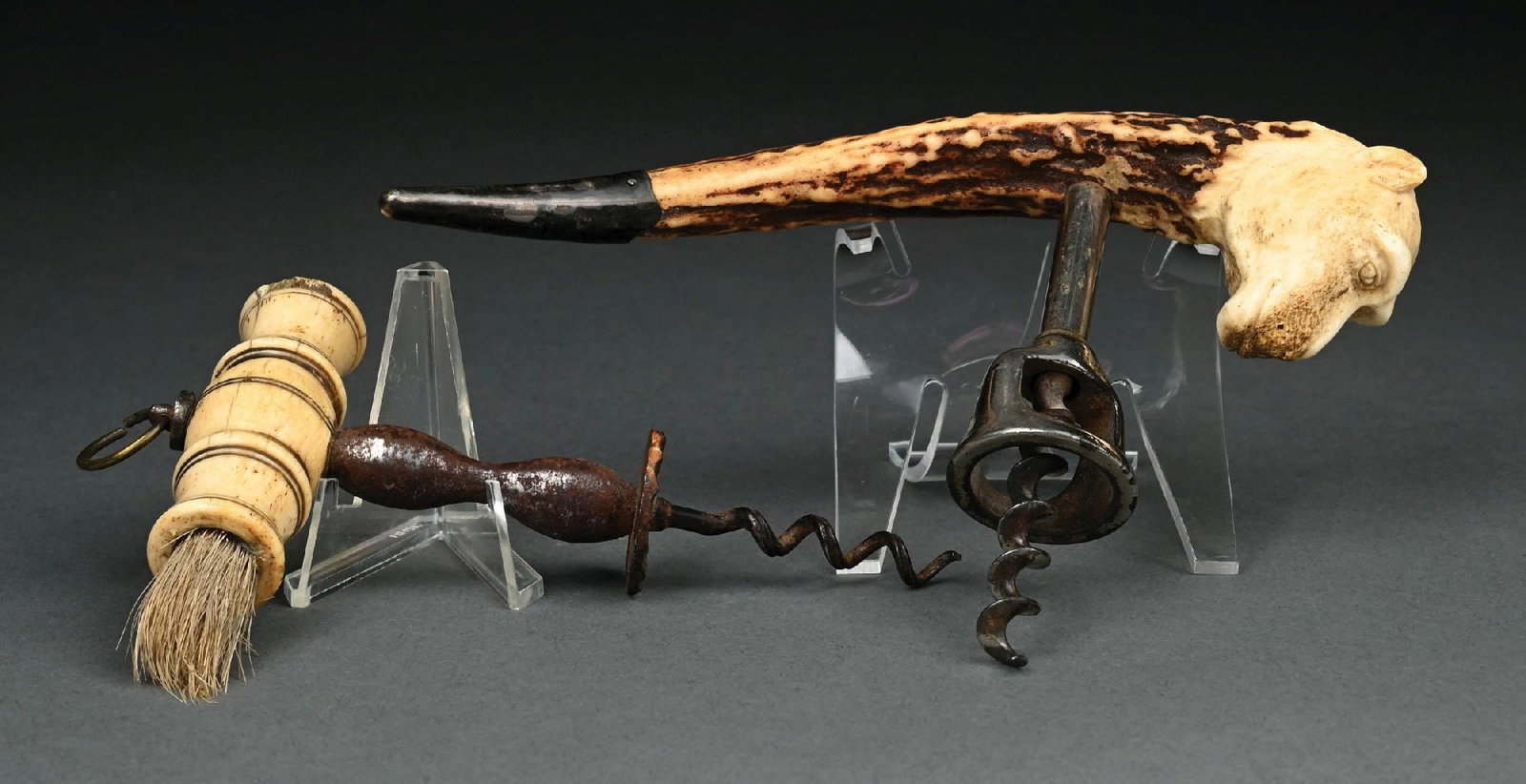 COLLECTION OF 2: CORKSCREWS: (A) C. 1870s–1900. A turned bone corkscrew with a brush top, featuring a bone handle, steel worm, and integrated bottle cleaning brush, used as a bar tool. The metal section from underneath the 