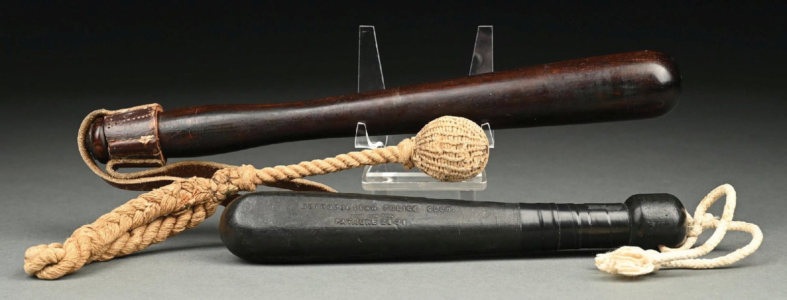 COLLECTION OF 3: BILLY CLUBS: (A) C. 1900s–1930s. A rope-handled weighted sap, typically used by police, prison guards, security personnel, and for crowd control. The club features a braided rope handle, weighted striking