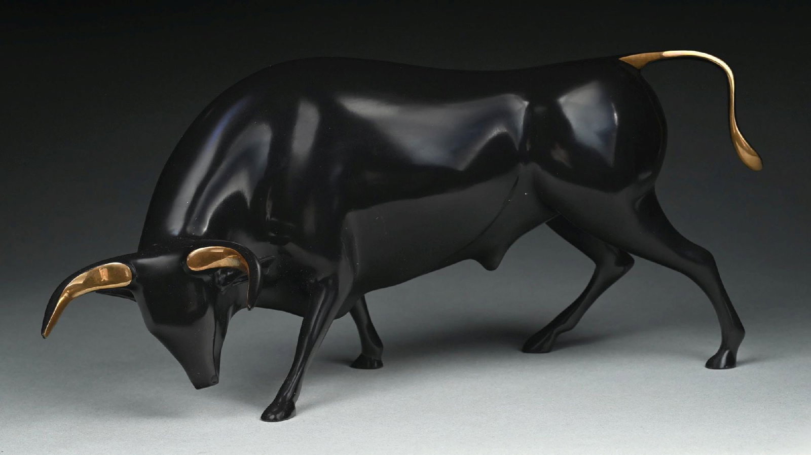 LOET VANDERVEEN (DUTCH, 1921-2015): Bull, Toro Bronze sculpture with patinated black finish with polished golden-gilt accent to the horns and the tail Signed on the underside "Loet" © 222/750 Comes with Certificate of Authenticity 
