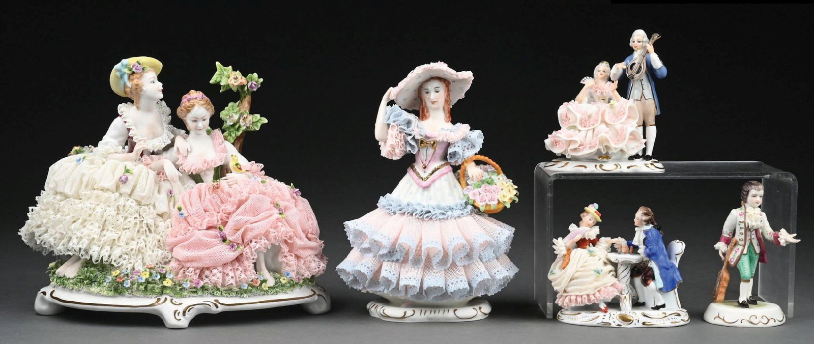 COLLECTION OF 5: SITZENDORF GERMANY AND MULLER VOLKSTEDT IRISH DRESDEN LACE PORCELAIN FIGURINES.: Very nice collection of Dresden figurines. Most are stamped under base. Condition: (Excellent). Dimensions: Largest: 9" x 5 - 1/2" x 8".