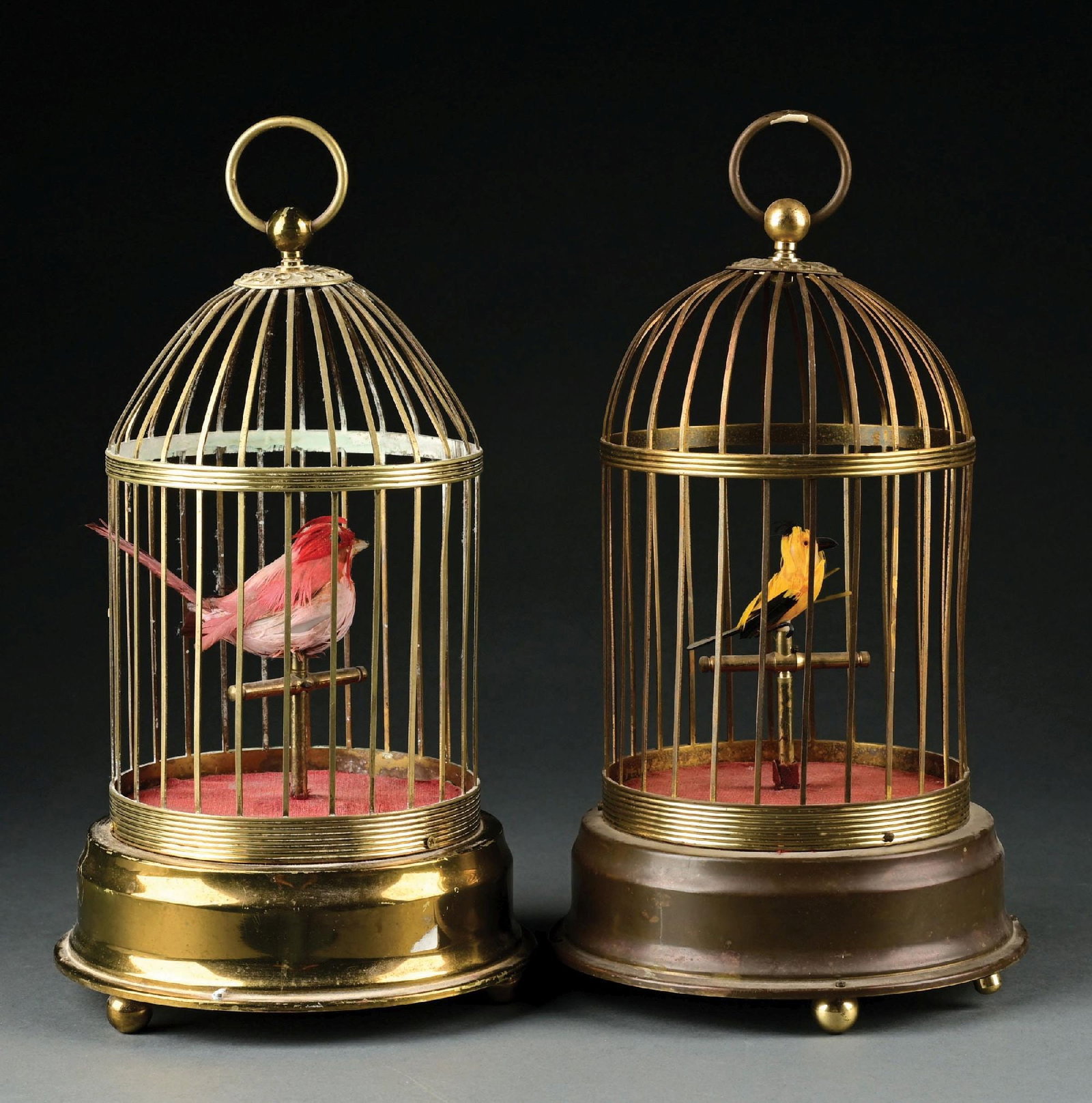 PAIR OF SINGLE BIRD GERMAN BIRD CAGES: (A) Oversized bird automaton, showing light wear and operational. Cage is firm, and no breaks or bends. (B) Single bird automaton in working order, with great color and little wear. Condition: (Very G