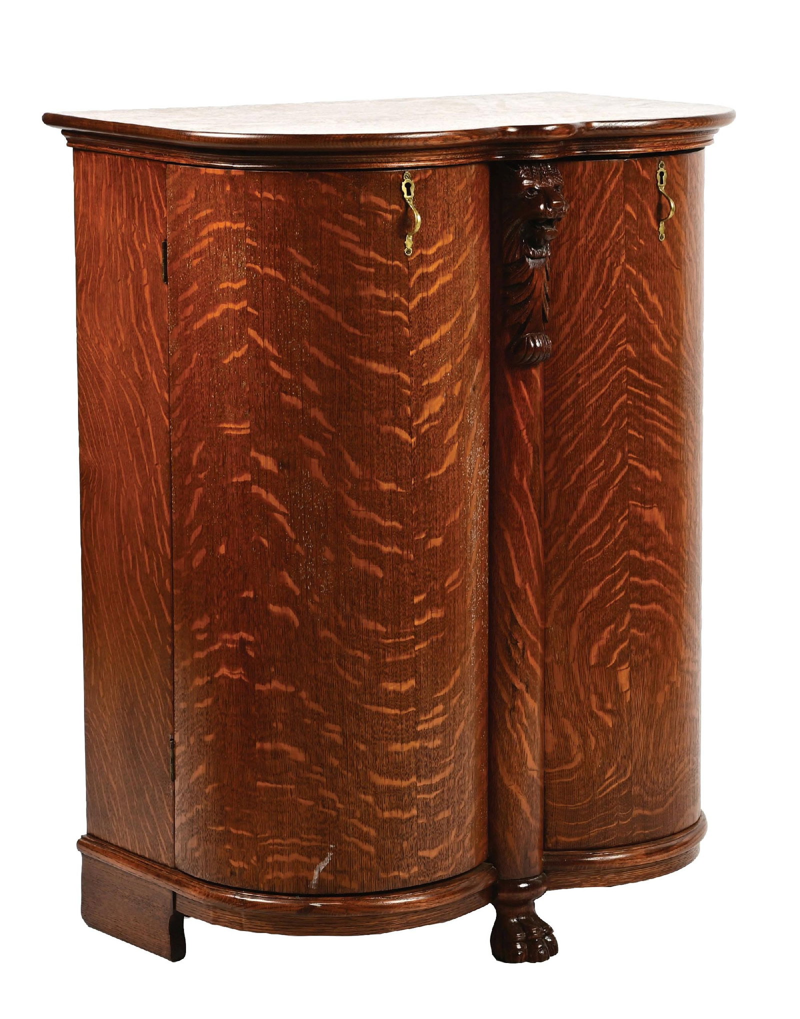 BEAUTIFUL QUARTERSAWN OAK DOUBLE BOMBAY DOOR PHONOGRAPH RECORD STAND: It shows quartersawn oak with no lifting veneer. A carved lion front with complete interior and felt-lined record racks. This is not a standard shippable item and will require 3rd party shipping or pi