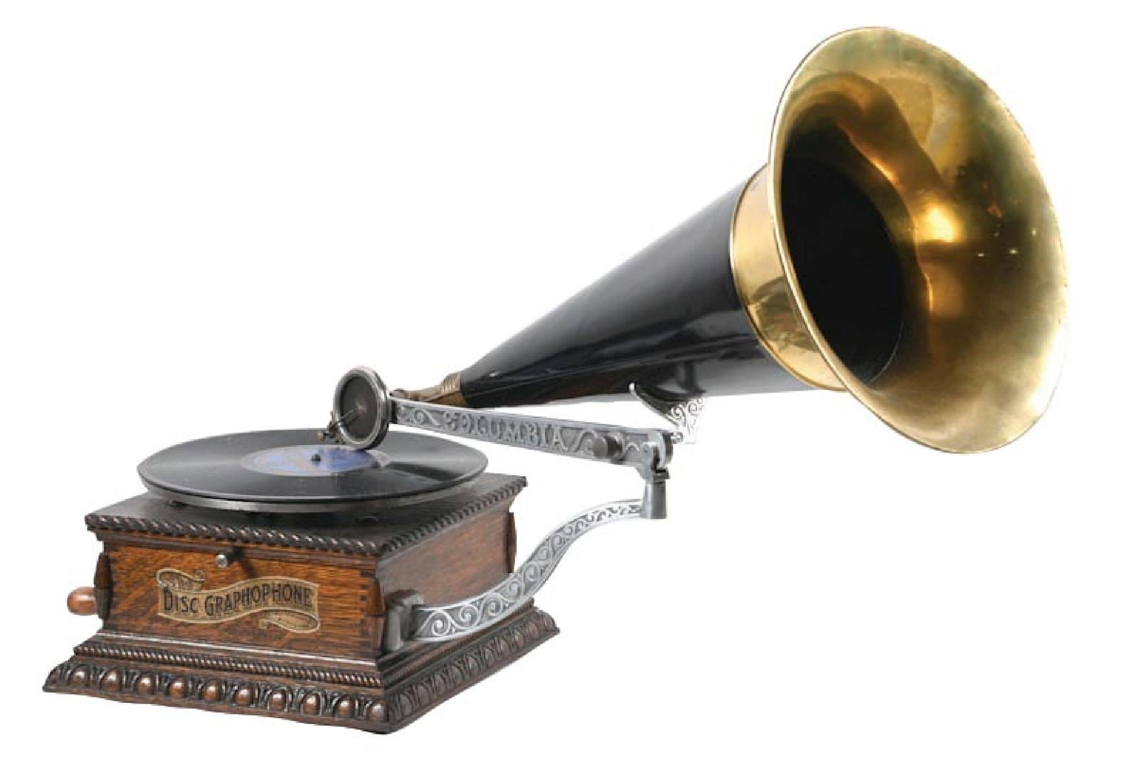 COLUMBIA DISC GRAPHOPHONE PHONOGRAPH: C. 1898. Original finish to the oak cabinet with original decal, with correct reproducer, correct crane, correct turntable with new felt, and correct crank. With replaced bell horn. Fully