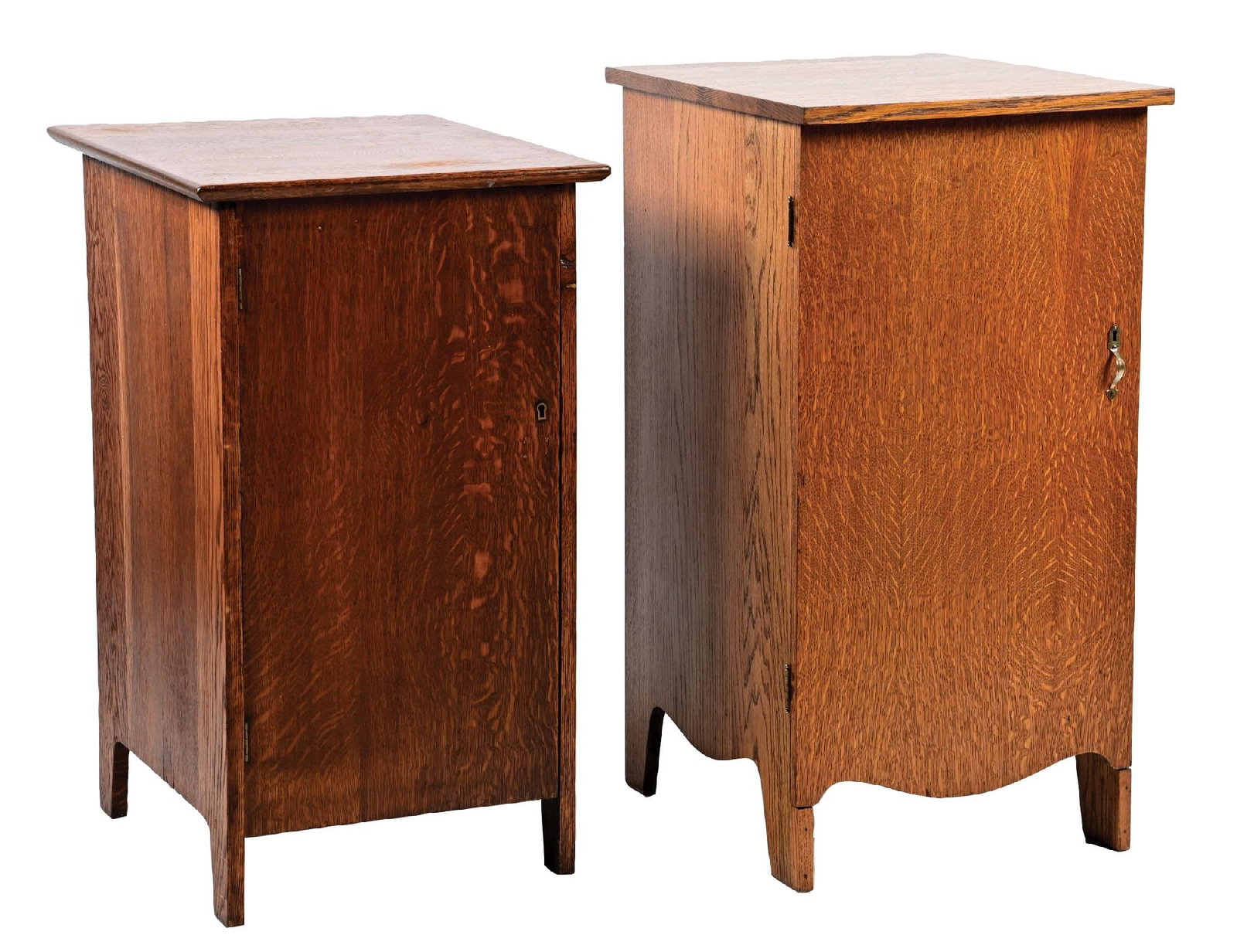 A PAIR OF OAK PHONOGRAPH STANDS: (A) Dark stain phonograph stand with shelved interior. Wear to the finish from use and some age cracks. (B) Oak Veneer phonograph stand with light wear overall from use. Shelved interior and correct h