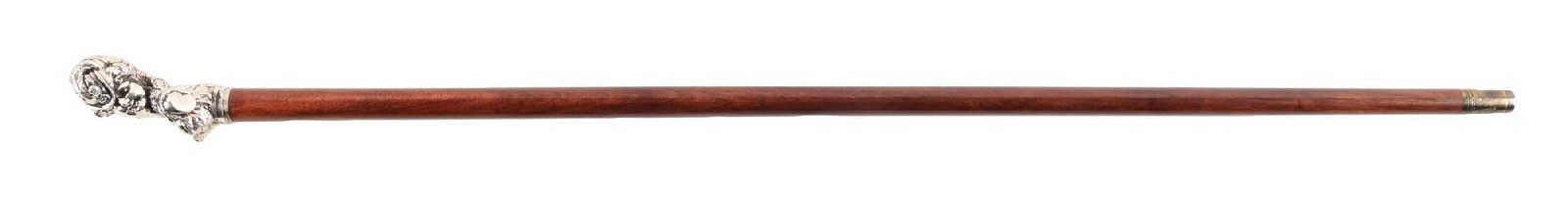 ANTIQUE CARVED STERLING SILVER EROTICA WALKING STICK: C. 1890–1915. Sterling silver figural bust walking cane depicting a female figure with draped head covering, flowing hair, and jewelry, showing Art Nouveau influence. Mounted to a hardwood shaft
