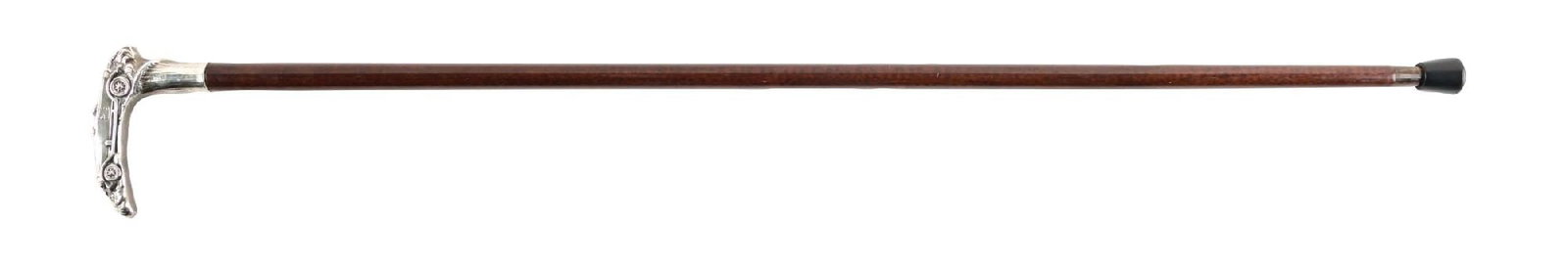ANTIQUE WALKING CANE WITH SILVER CARVED AUTOMOBILE HANDLE: C. 1910–1930. Figural silver automobile-handled walking cane depicting an early touring car with spoked wheels and open passenger compartment. Mounted to a silver collar and dark hardwood shaft,