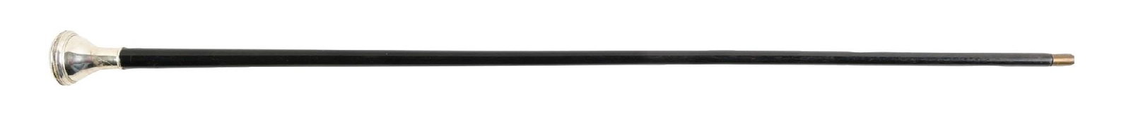 ANTIQUE WATCH TOP WALKING STICK CANE WITH KEY: C. 1880–1910. Watch-top gadget walking cane with concealed timepiece housed in a domed metal handle, opening to a Roman numeral dial. Includes winding key. Black hardwood shaft. Typical late Vic