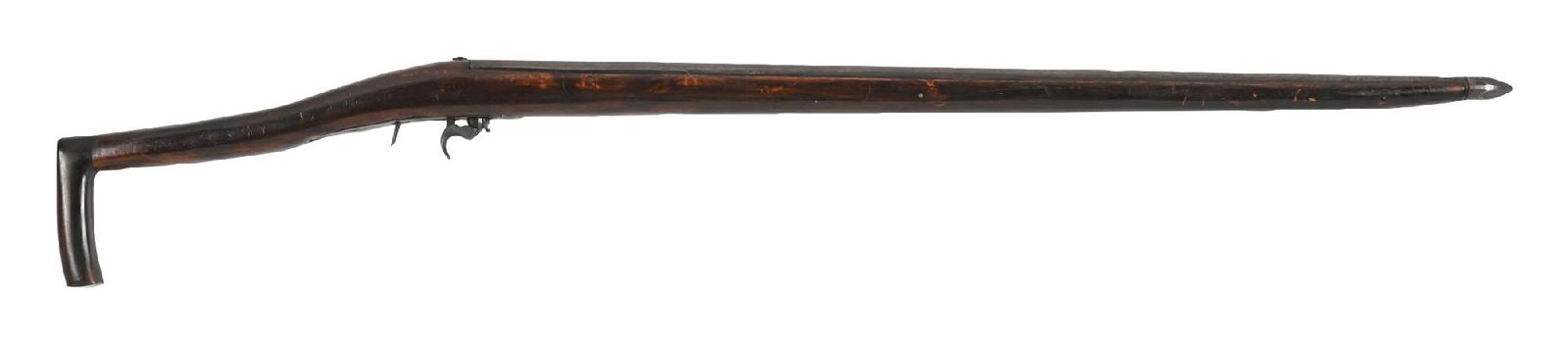 MASSIVE GUN CANE: C. 1880–1910. A solid very large gun cane featuring a wooden handle with a steel and wood shaft and steel ferrule. The cane retains visible cocking and trigger mechanisms. Condition shows typica