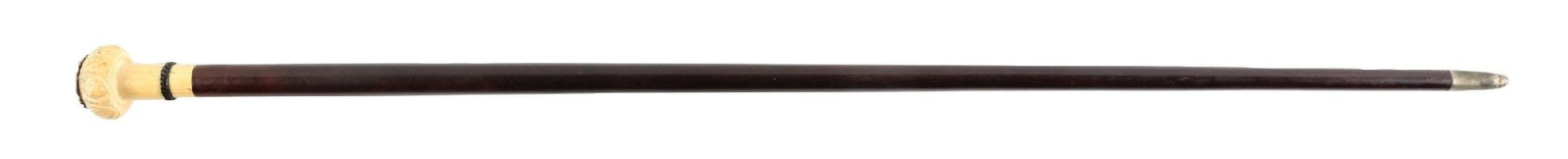 S. HELENAE ULTINENSIS, V WALKING STICK CANE: C. 1850–1880. Religious reliquary walking cane featuring a carved handle with glass-covered devotional compartment containing a relic labeled “S. Helene Ultinensis V,” referencing Sa