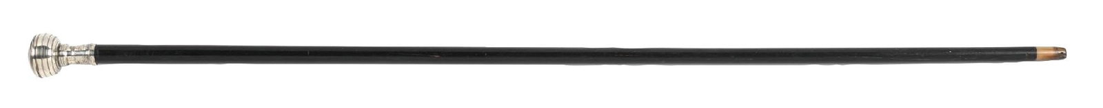WATCH SYSTEM STICK CANE: Watch System Stick Cane - C. 1885 - A white metal cased knob, ebonized shaft and a horn ferrule. The 2 - 1/4" knob is fitted with a cylinder movement, winding watch. It has an enamel signed Brevete