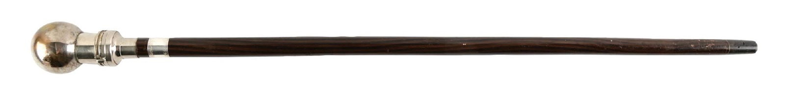 POLISHED METAL MEDICAL GADGET WALKING CANE W/ DARK WOOD SHAFT: C. 1920–1935. Medical instrument walking cane featuring a spherical reservoir handle containing a removable B-D Multifit glass hypodermic syringe with interchangeable needle attachments. Screw-o