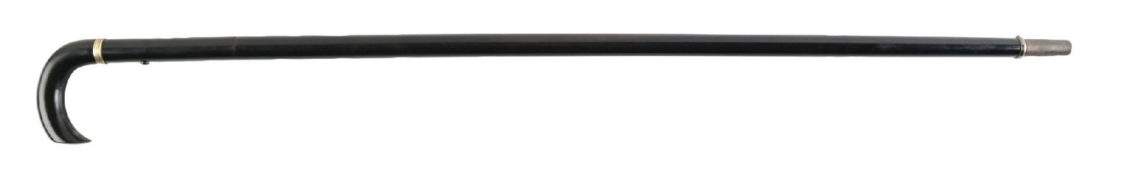 METAL PERCUSSION GUN CANE: C. 1920–1940. Concealed firearm cane with curved crook handle and black lacquered hardwood shaft, separating at mid-shaft to reveal an internal metal barrel and spring-loaded firing mechanism