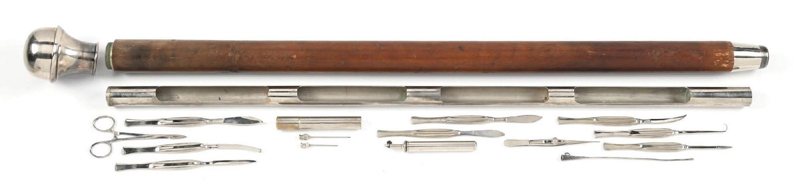 SURGEON'S CANE: Massive and heavy cane with silver silver knob handle, wood shaft, silver ferrule, cap comes off and tube pulls out for access to surgical tools. The cane is in very good condition, mild chipping and