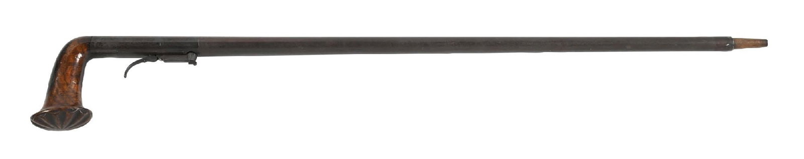 UNDERHAMMER PERCUSSION GUN CANE: C. 1800s. A fine underhammer percussion gun cane, featuring a large rosewood “L”-shaped handle, the terminal carved with a bold sunburst motif. The top of the handle retains a metal fittin