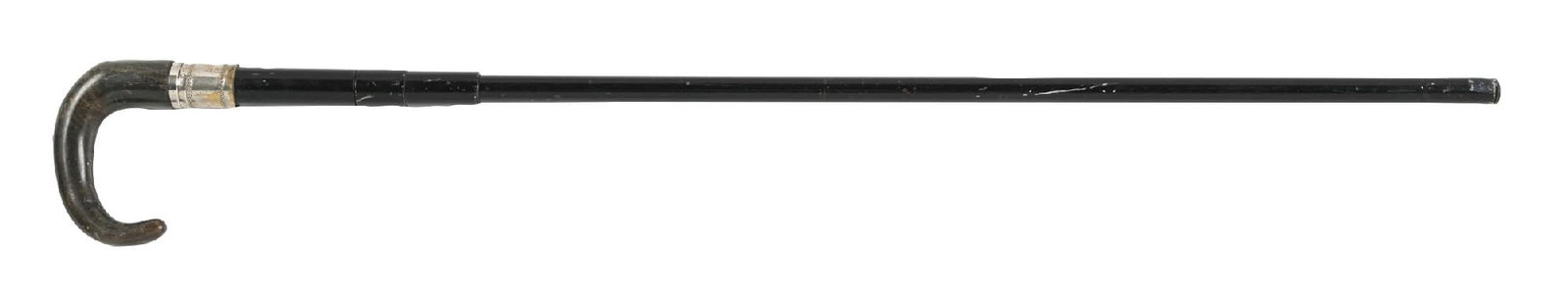 HORN HANDLE GUN CANE: C. 1800s. A striking gun cane featuring a crocodile horn “L”-shaped handle and a black metal shaft. The handle twists to reveal the bullet chamber, while the removable ferrule stopper expo