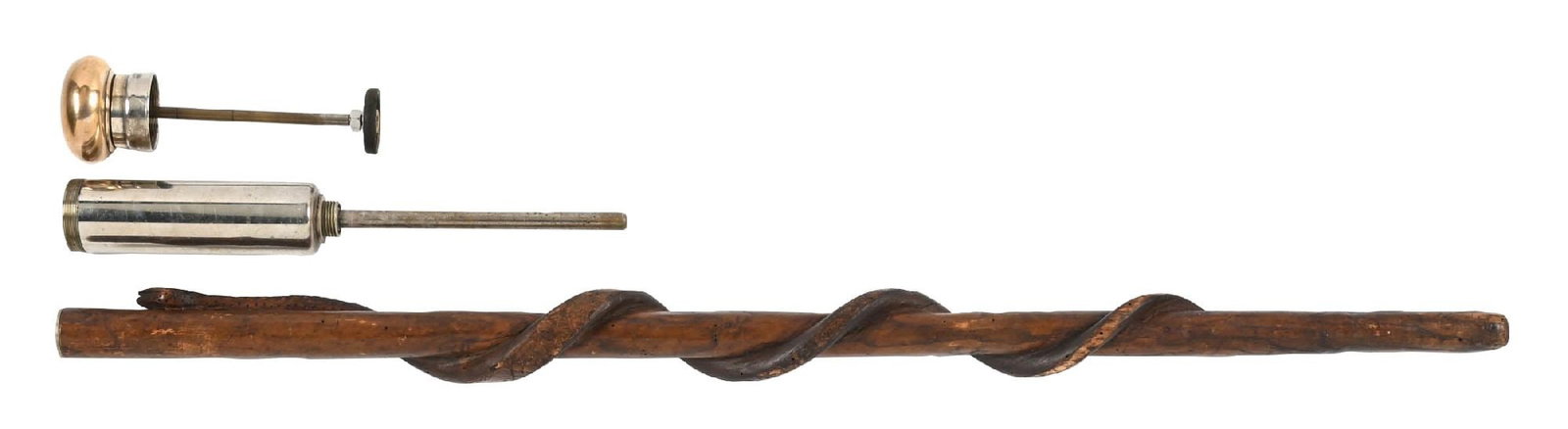 CATTLE ENEMA CANE: C. 1900. A fantastic cane made of hickory wood featuring a carved snake curling up the length in imitation of the rod of Asclepius. The grip is set into a large, iron cylinder. When removed from the